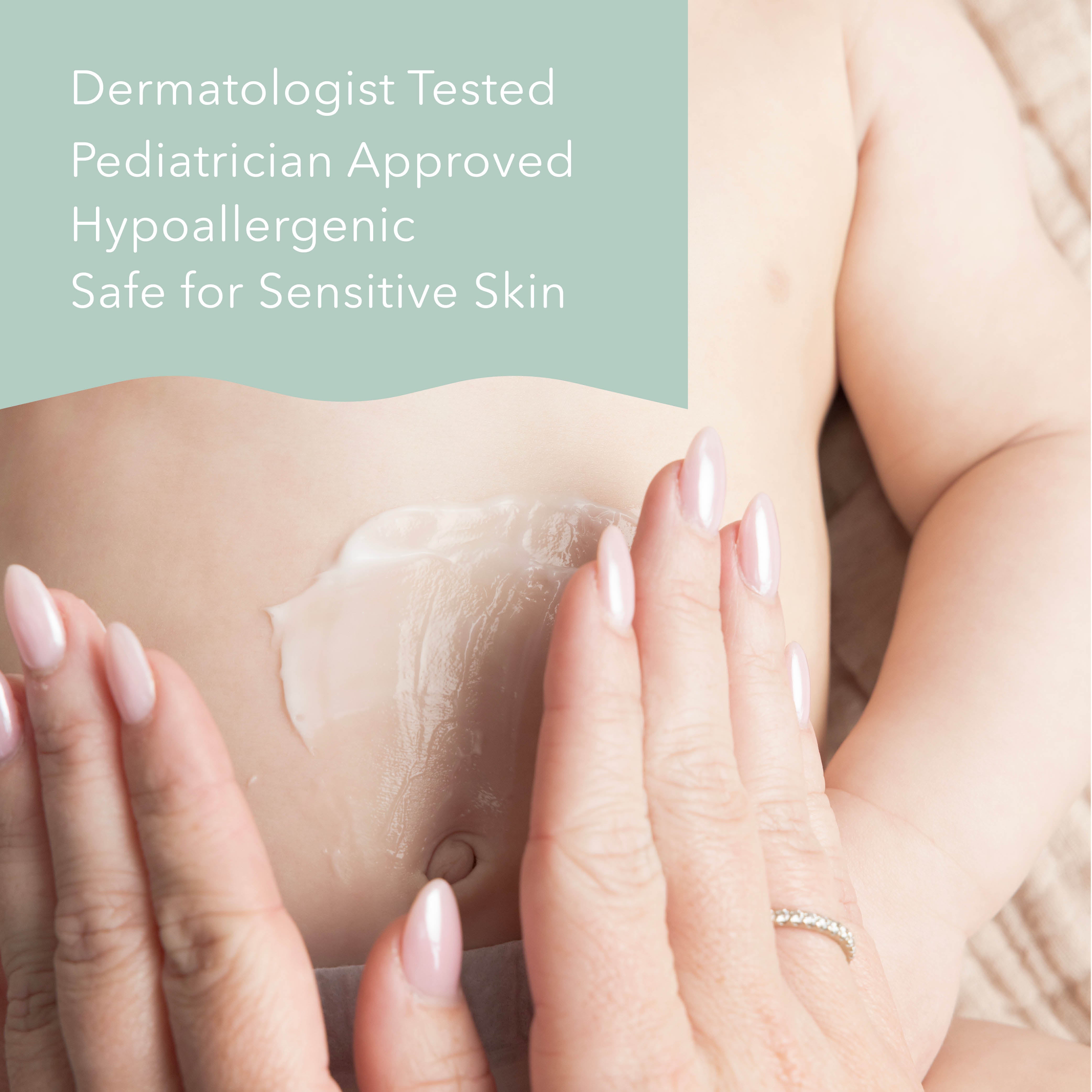 Close-up of a baby's stomach with a thick white cream being spread by an adult hand with pale pink manicured nails. A mint green text banner on the top left reads: 'Dermatologist Tested Pediatrician Approved Hypoallergenic Safe for Sensitive Skin'.