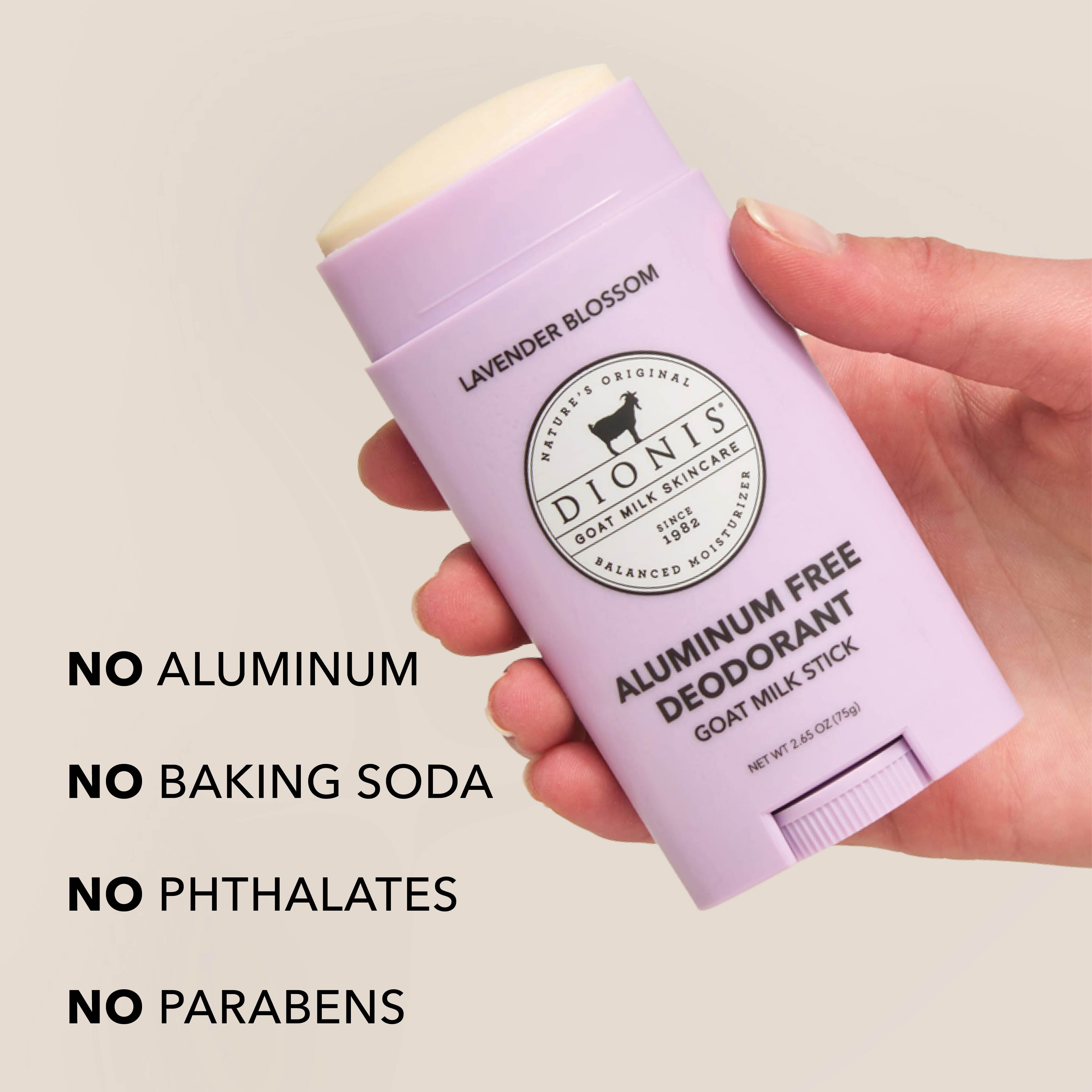 Hand holding Dionis Lavender Blossom Goat Milk Deodorant Stick. Text on the image reads "No Aluminum. No Baking Soda. No Phthalates. No Parabens."