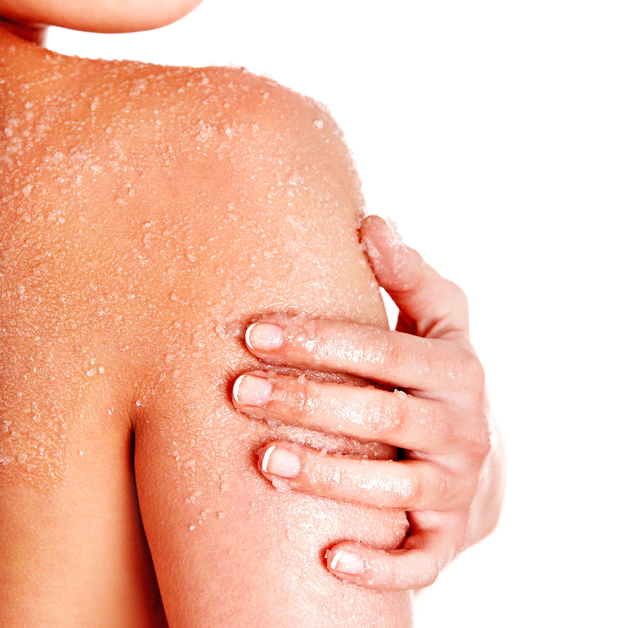 woman using Dionis Goat Milk Body Scrub on shoulder