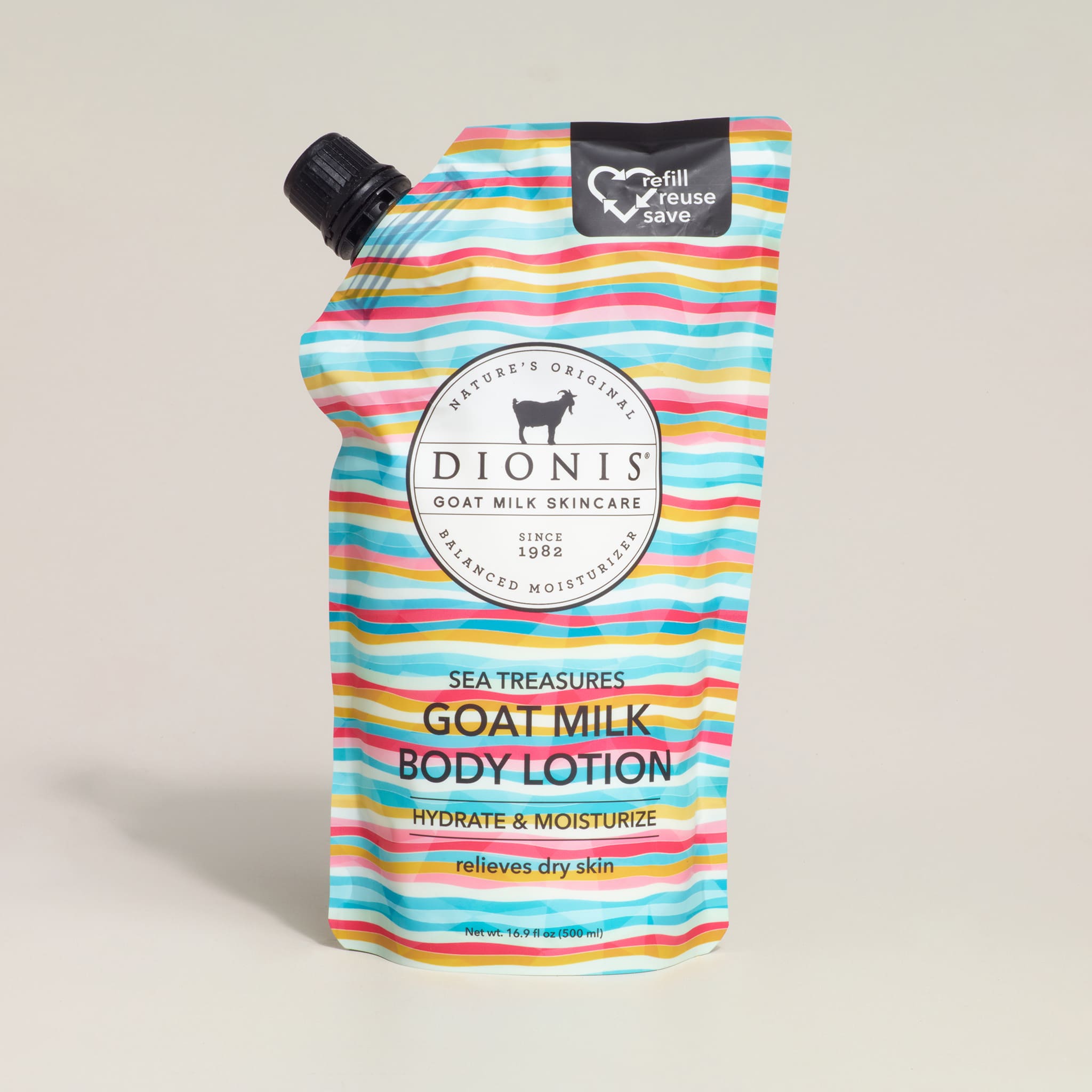 Dionis goat milk body lotion packaging with colorful stripes on a beige background