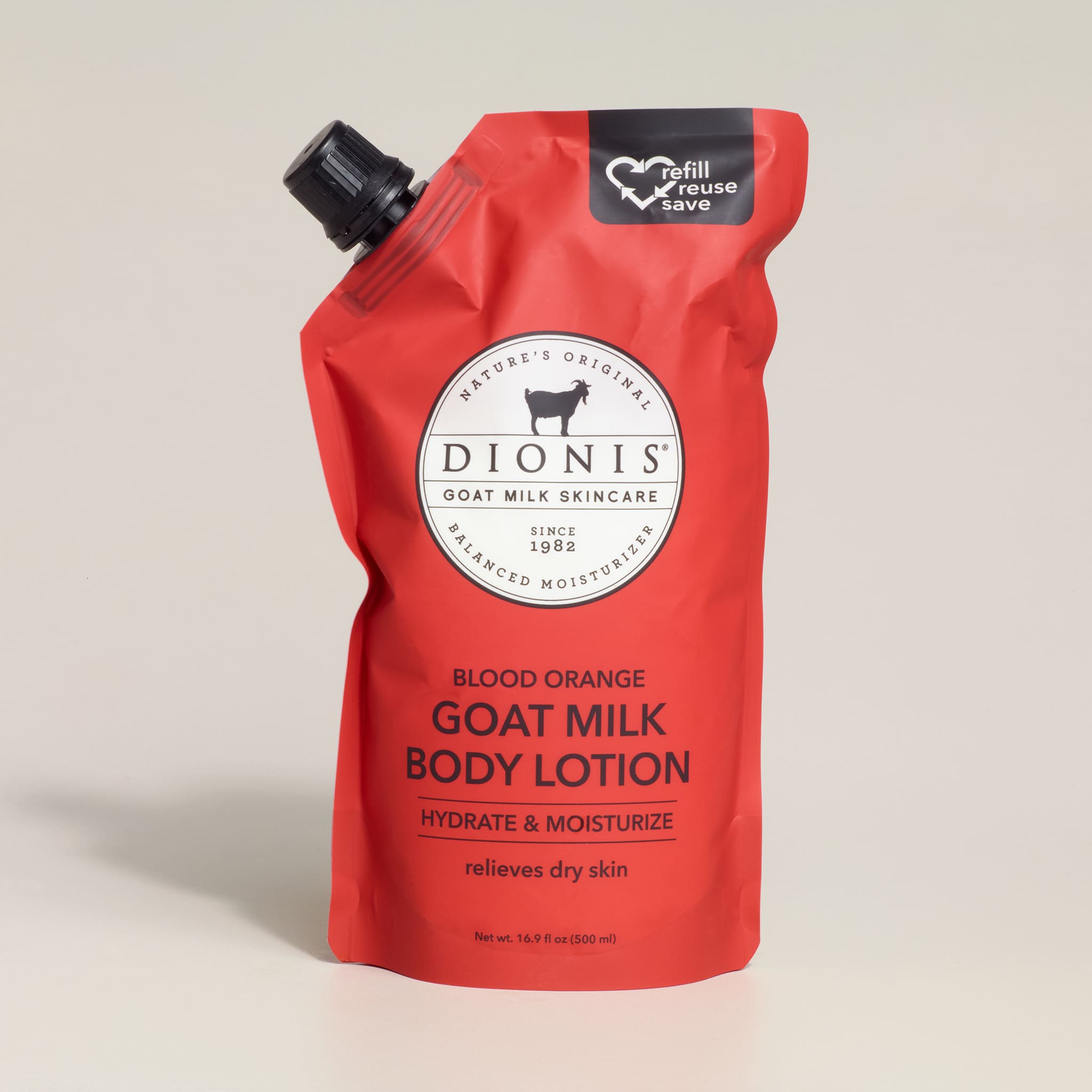 Red pouch of Dionis goat milk body lotion on a beige background