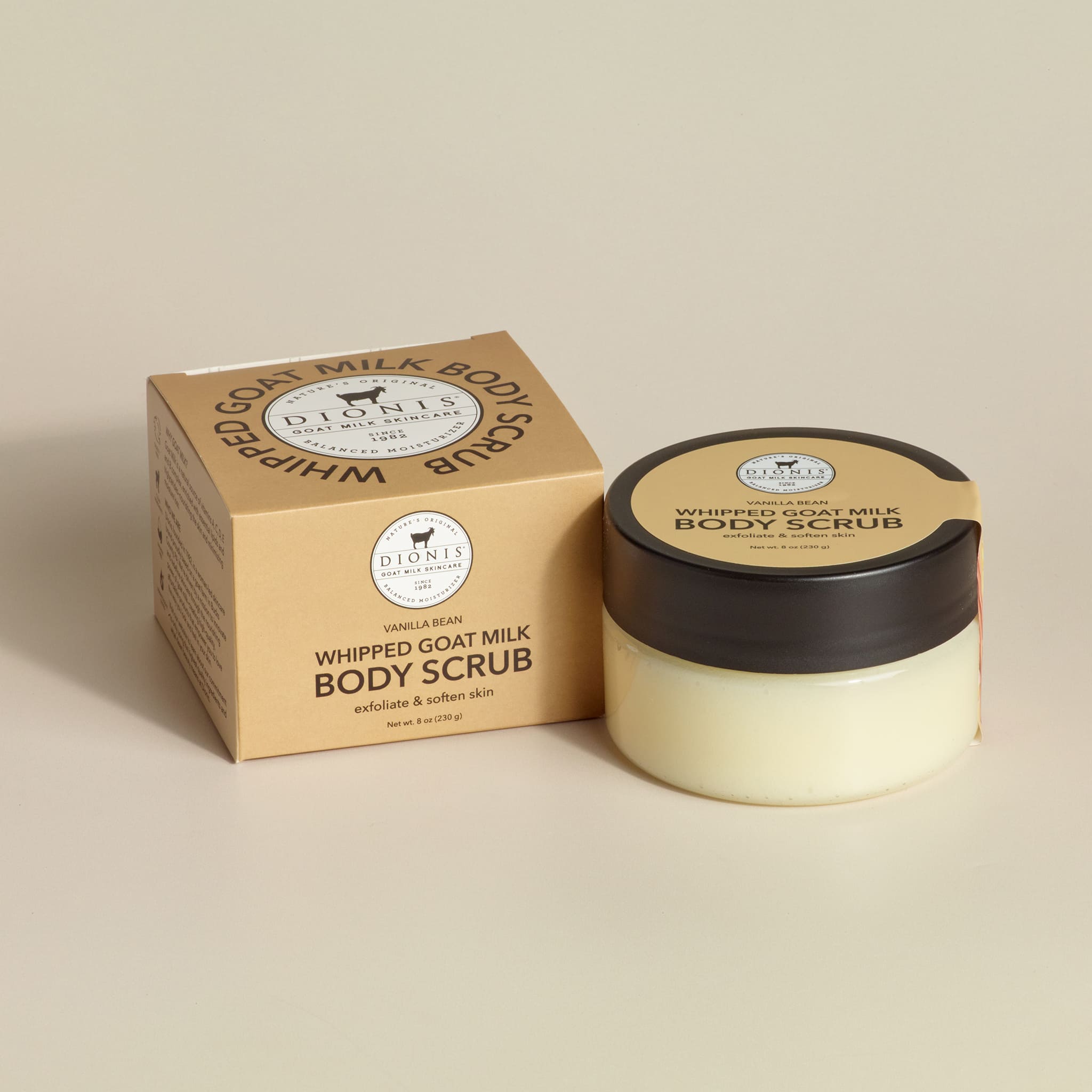 Dionis Goat Milk Skincare Vanilla Bean Whipped goat milk body scrub jar with box packaging on a beige background