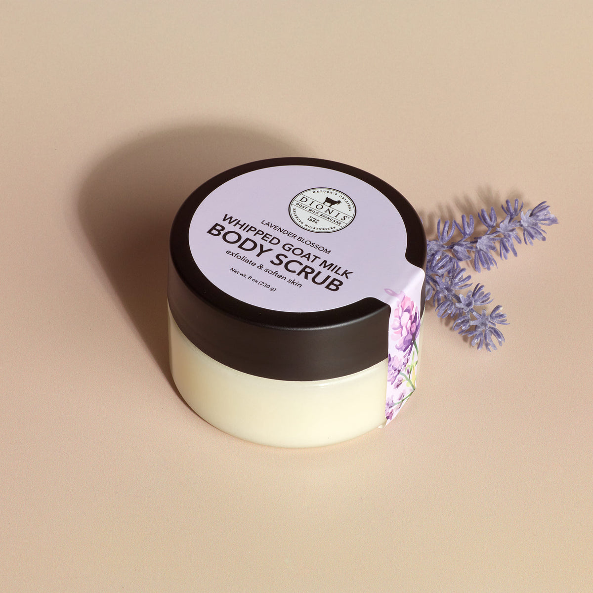 Dionis Lavender Blossom Goat Milk Body Scrub with lavender sprig prop