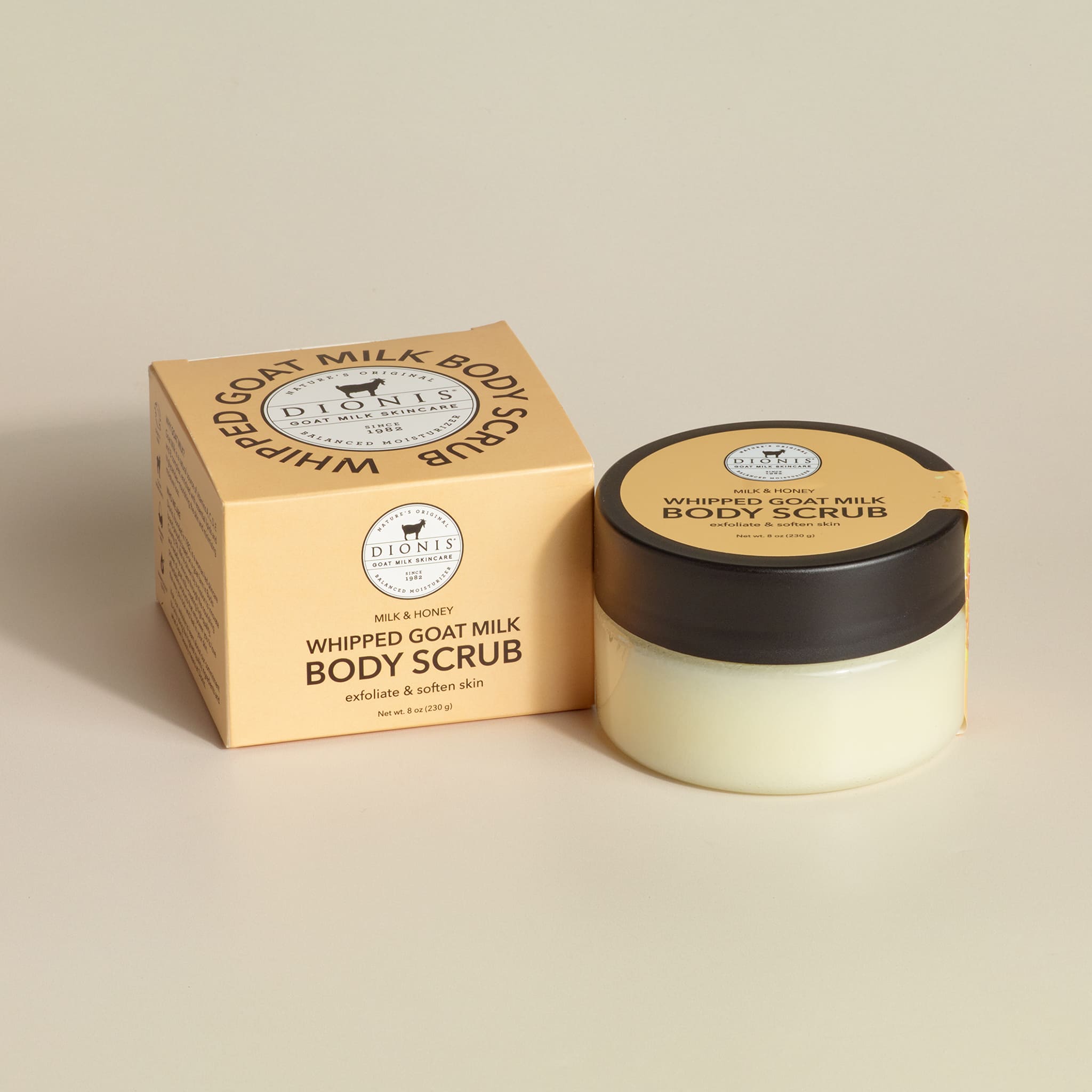 Dionis Goat Milk Skincare Milk & Honey Goat Milk Whipped Body Scrub in jar next to its box