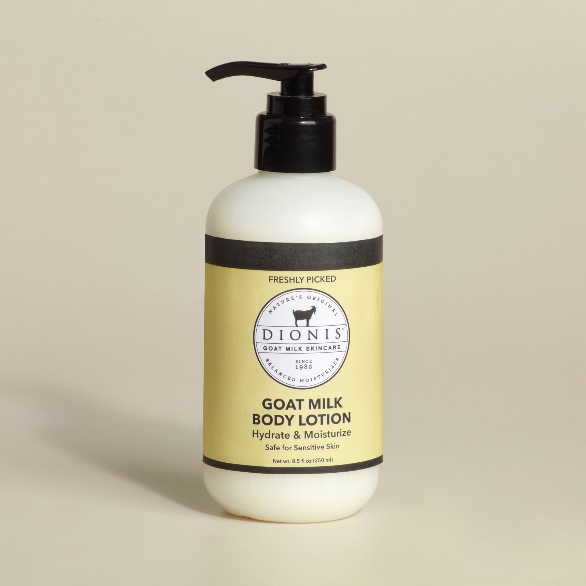 Dionis Freshly Picked goat milk body lotion bottle on a beige background