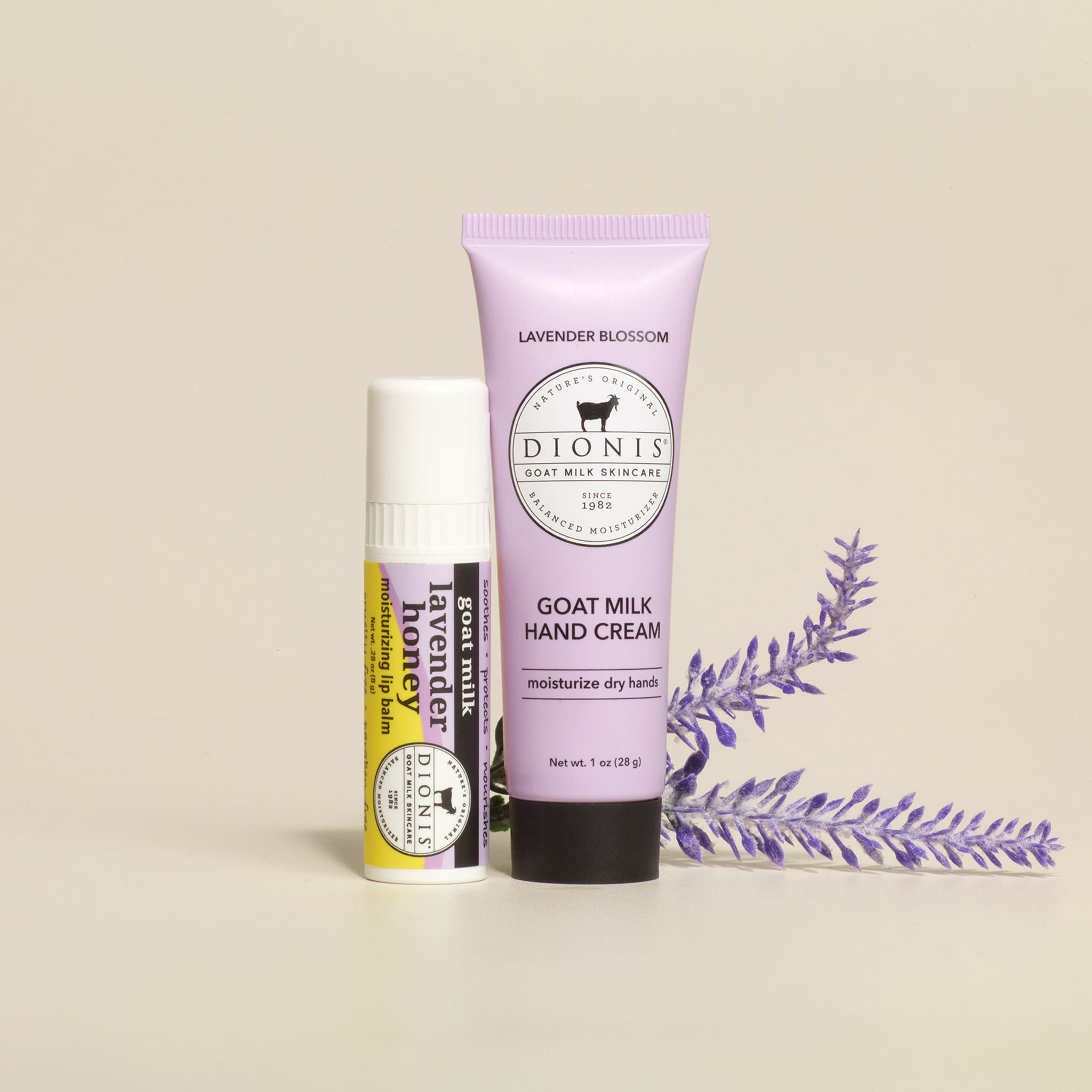 Dionis goat milk skincare products including hand cream and lip balm on a beige background with lavender.