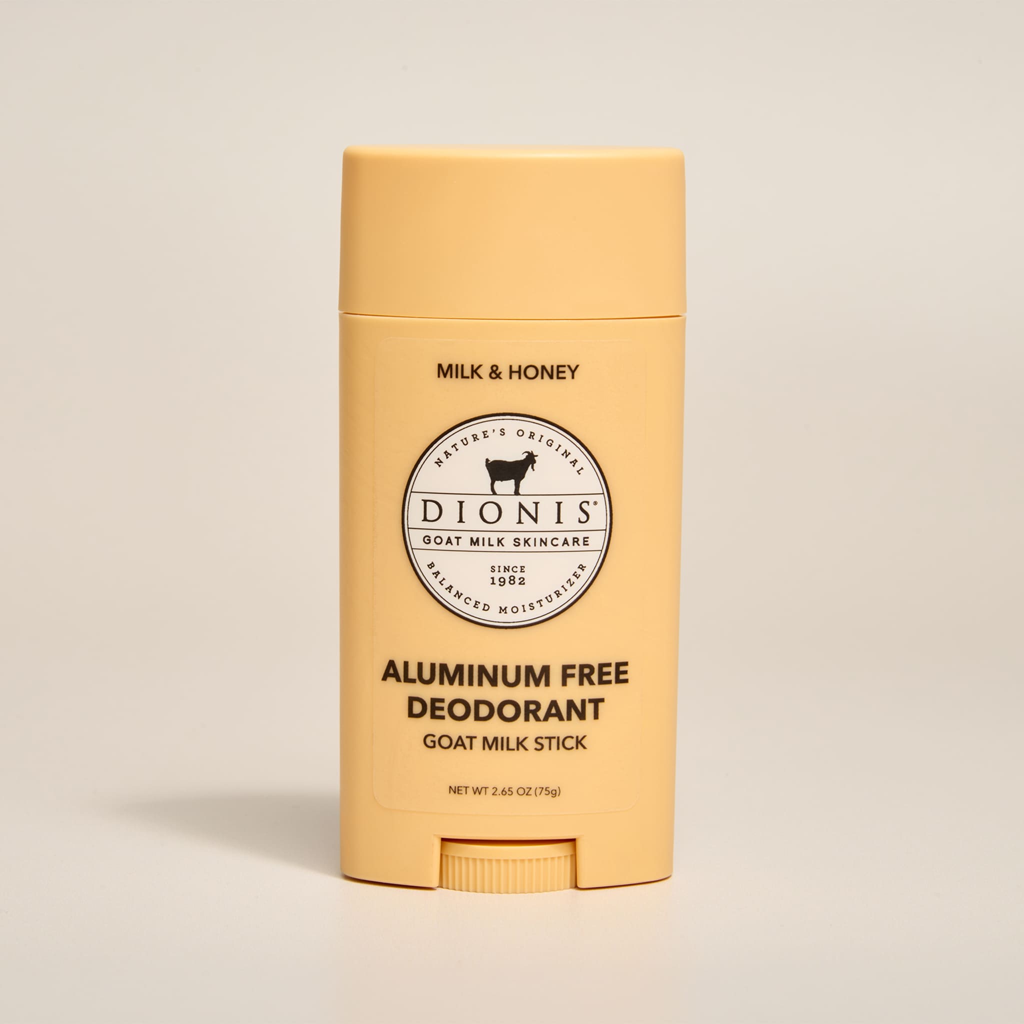 Dionis Milk & Honey aluminum-free goat milk deodorant stick on a beige background