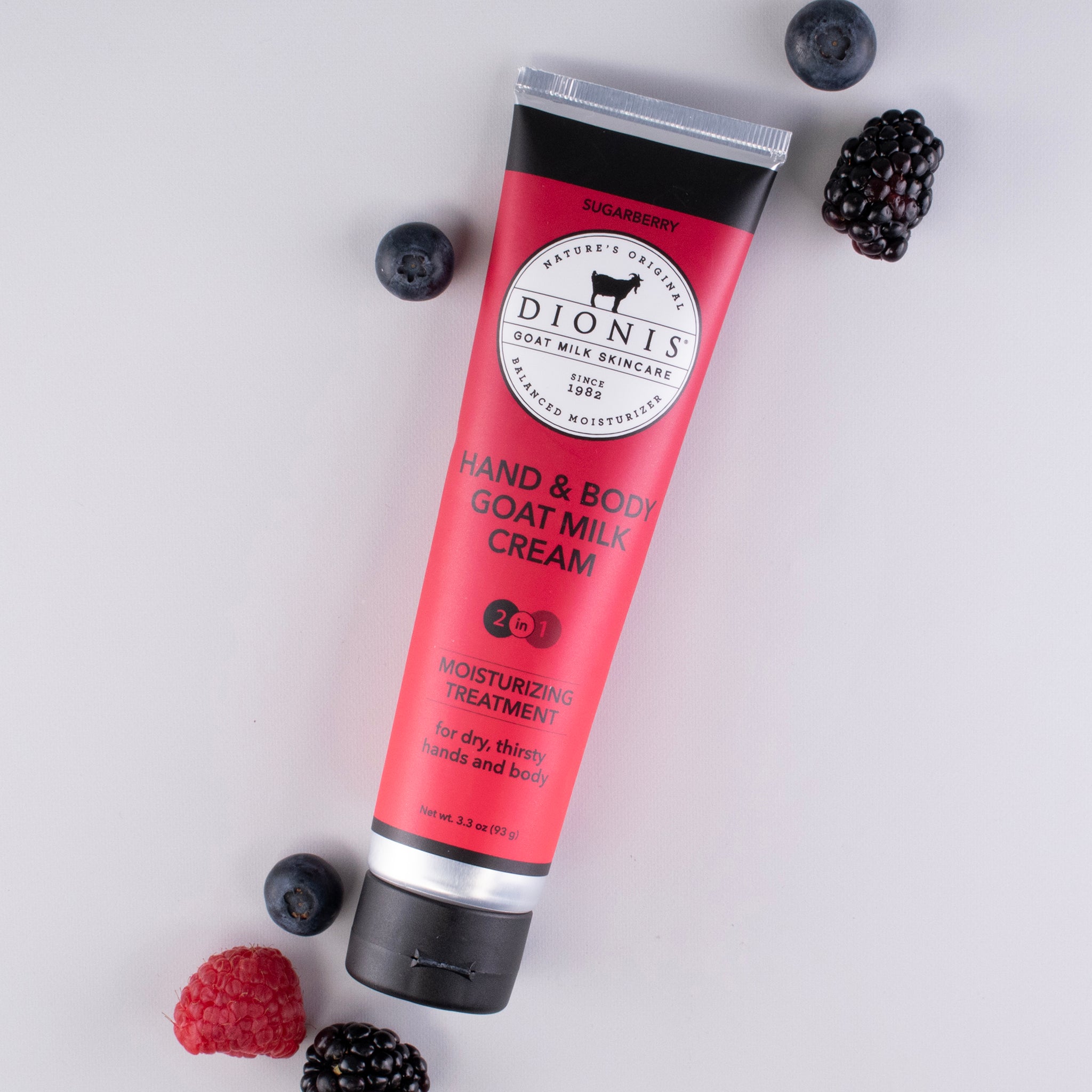 Sugarberry goat milk hand & body cream tube with fresh berries