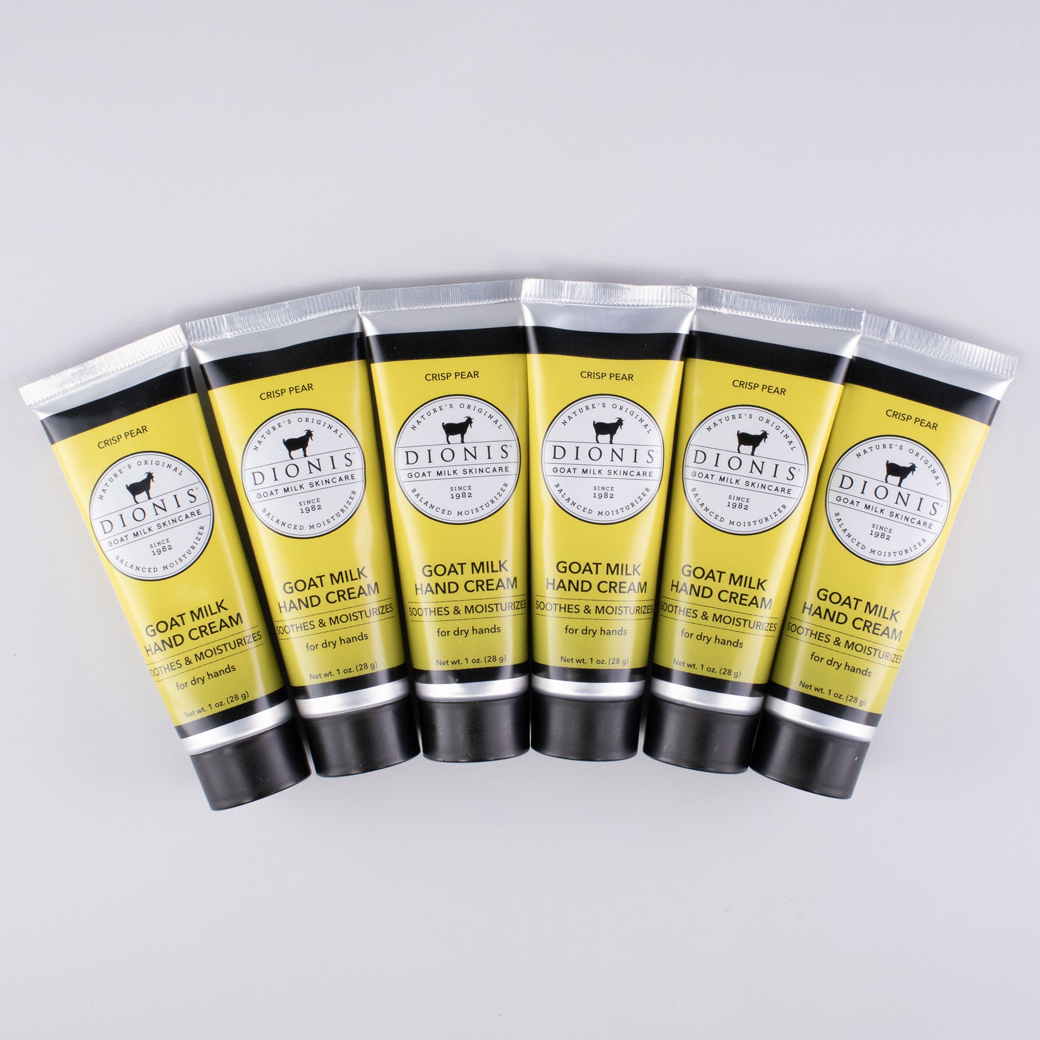 6 - 1 oz Crisp Pear goat milk hand creams lined up