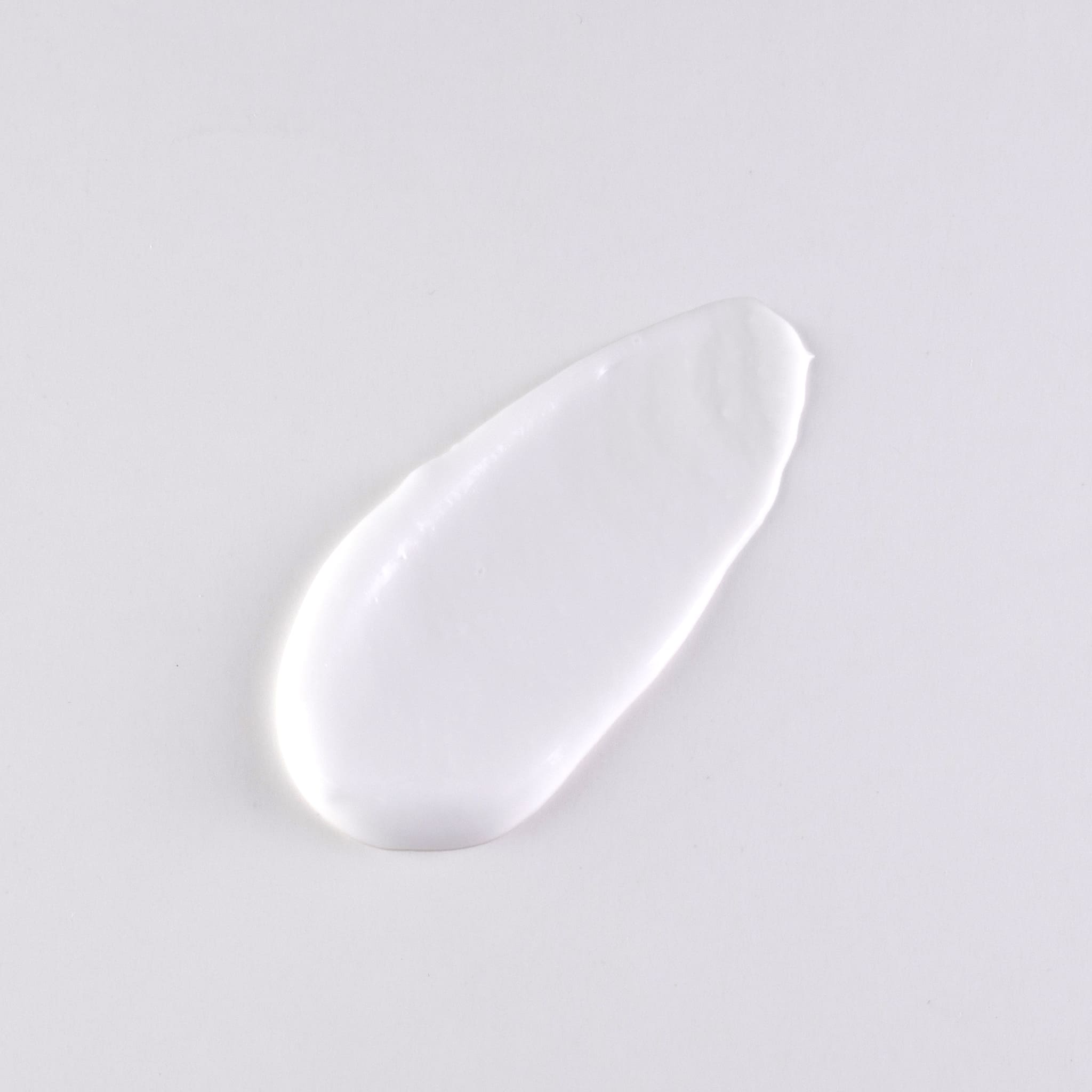 Swatch of goat milk body lotion on flat surface