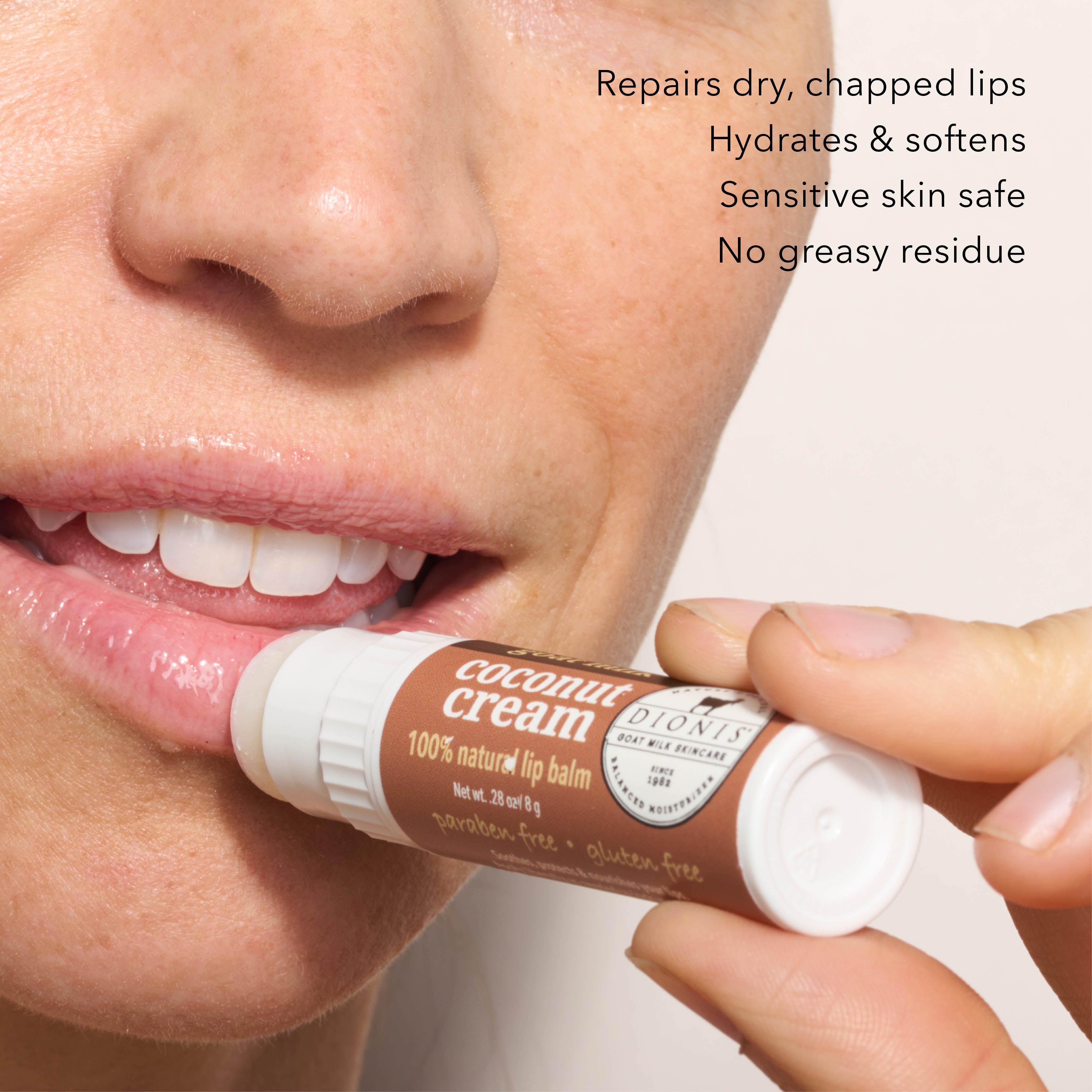 A close up of model applying Dionis Goat Milk Lip Balm, Coconut Cream, to lips. 

Benefits: 
- Repairs dry, chapped lips. 
- Hydrates & softens.
- Sensitive skin safe.
- No greasy residue. 