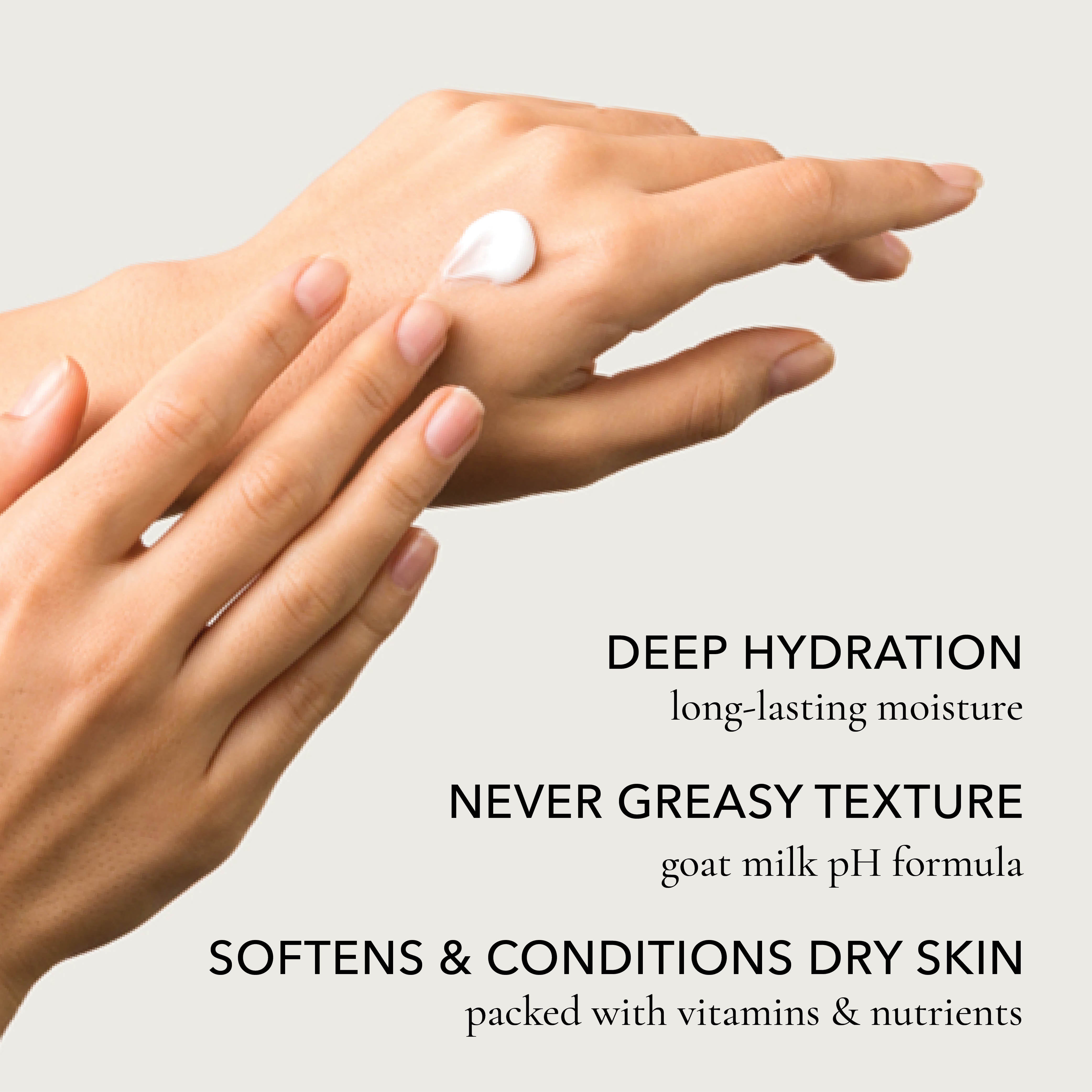 A close-up of hands applying a white cream to dry skin, with text on a light gray background reading: 'DEEP HYDRATION long-lasting moisture', 'NEVER GREASY TEXTURE goat milk pH formula', and 'SOFTENS & CONDITIONS DRY SKIN packed with vitamins & nutrients'.