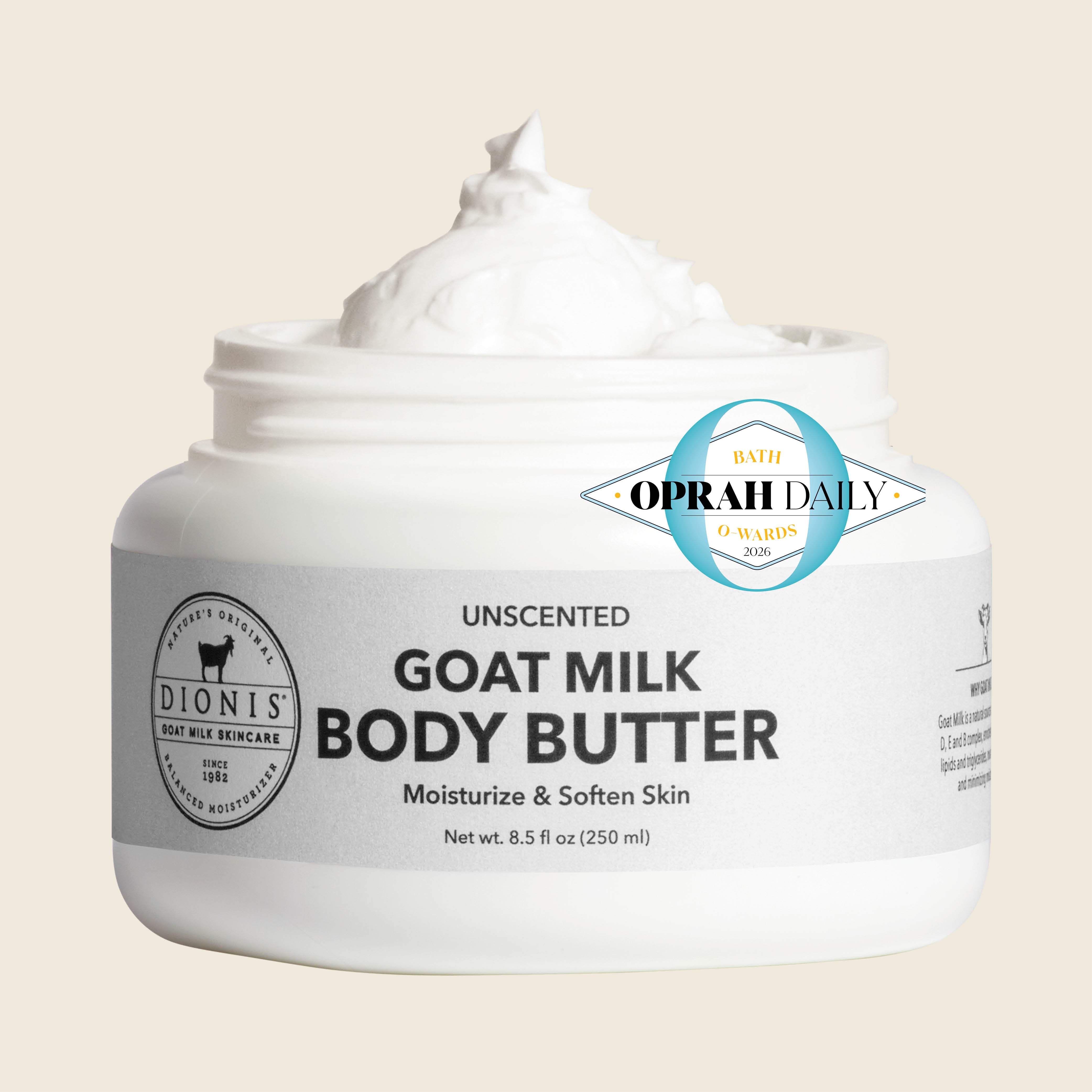 A white jar of Dionis Unscented Goat Milk Body Butter with a swirl of white cream visible at the top, set against a light beige background. A blue and white Oprah Daily badge is overlaid on the right side of the label.