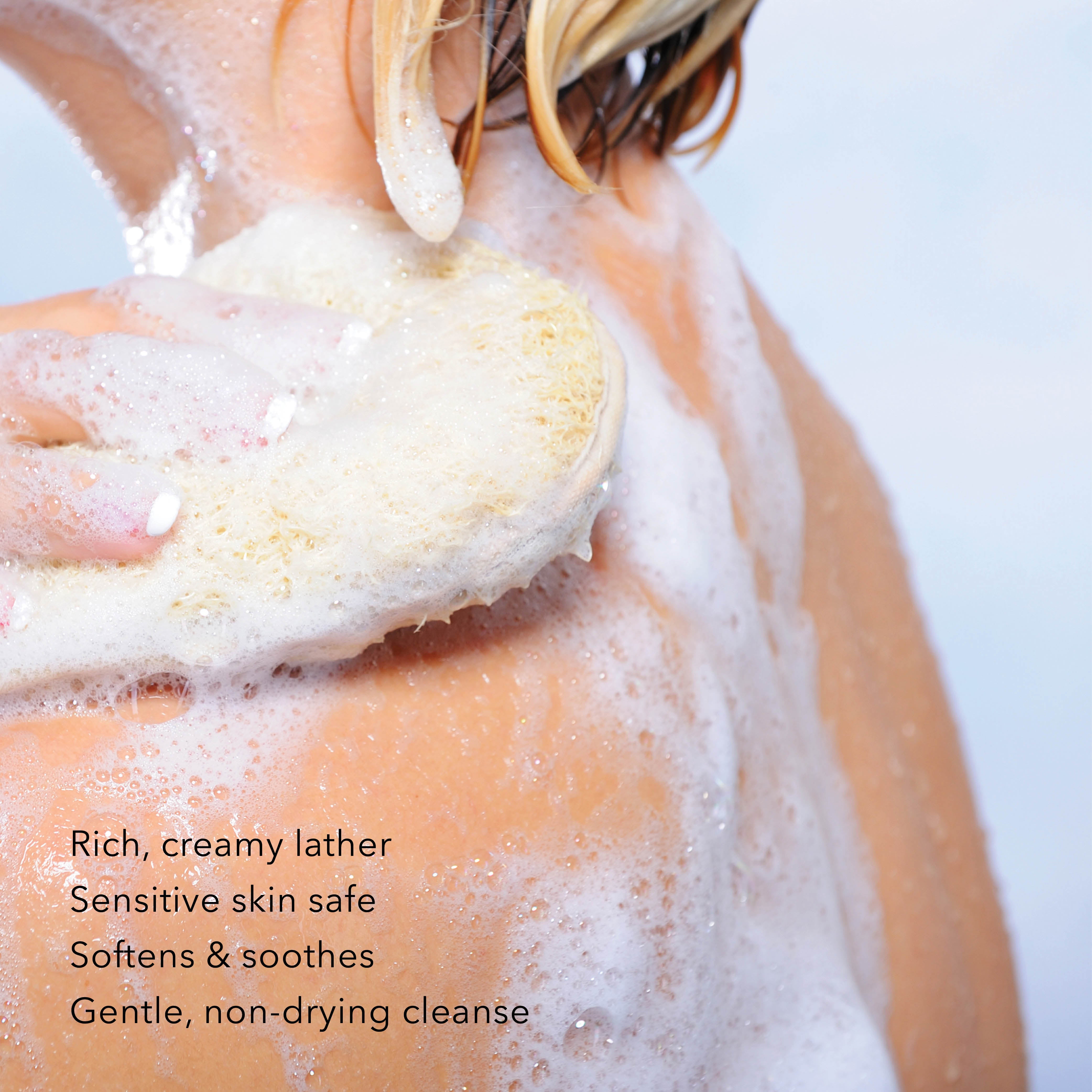 Person using a loofah with text about product benefits on a light background
Rich, creamy lather
Sensitive Skin safe
softens & soothes
gentle, non-drying cleanse