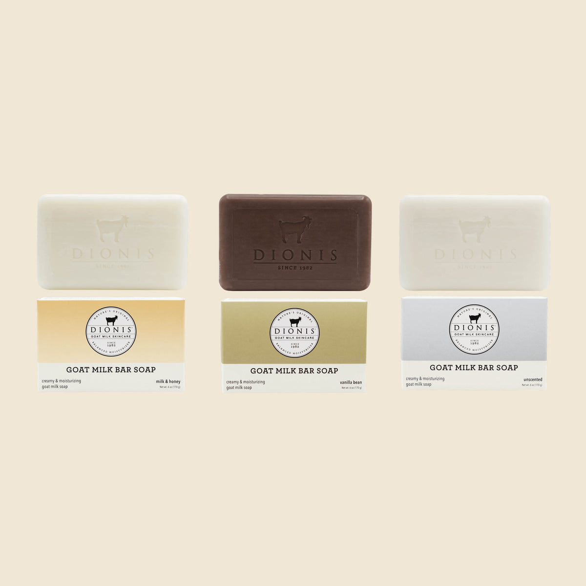 Three bar soaps from Dionis Goat Milk Bar Soap shown with their paper packaging on a white background. The soaps are arranged vertically in three columns: Milk & Honey on the left, Vanilla Bean in the center, and Unscented on the right.