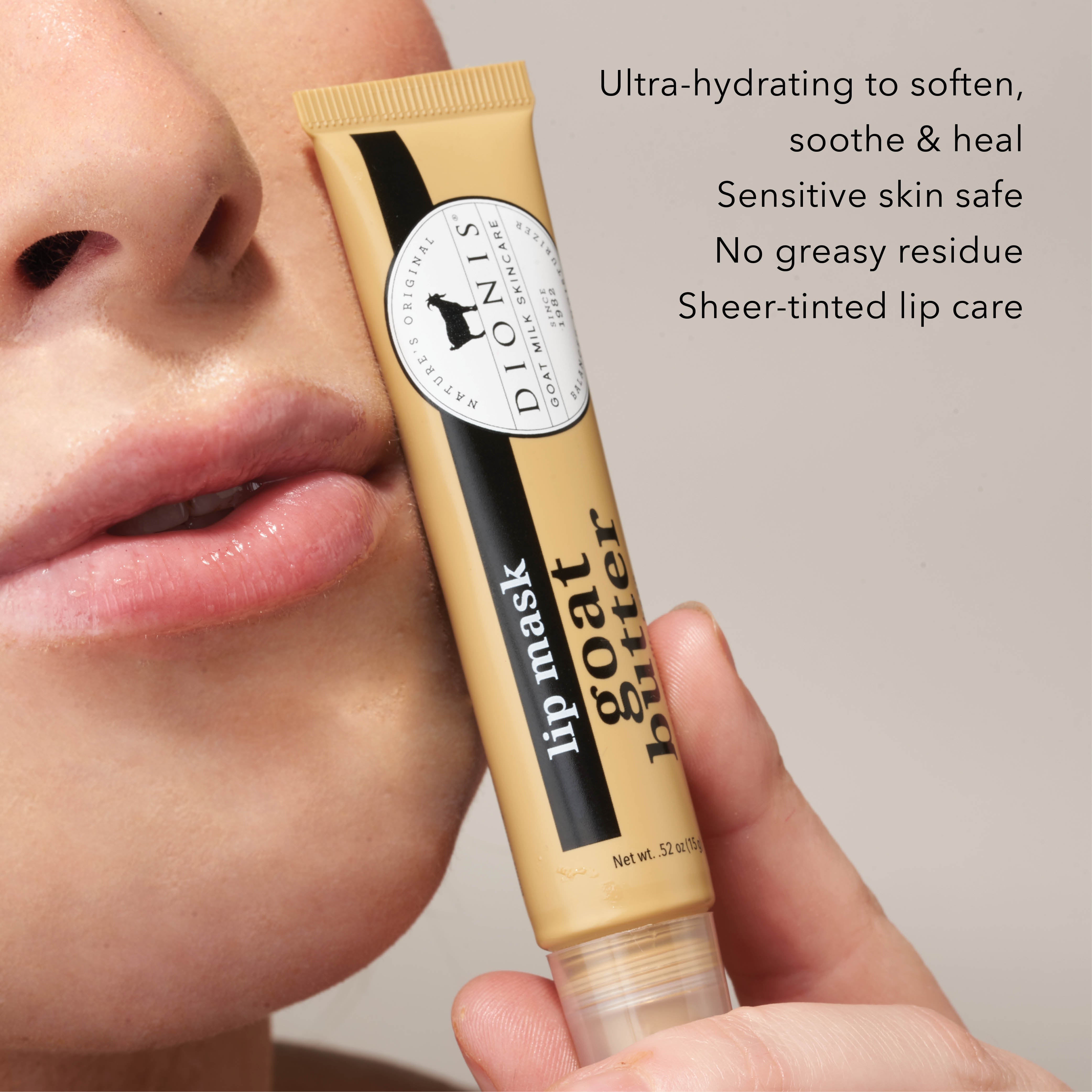 Woman holding Dionis Goat Butter Lip Mask tube up to her lips
