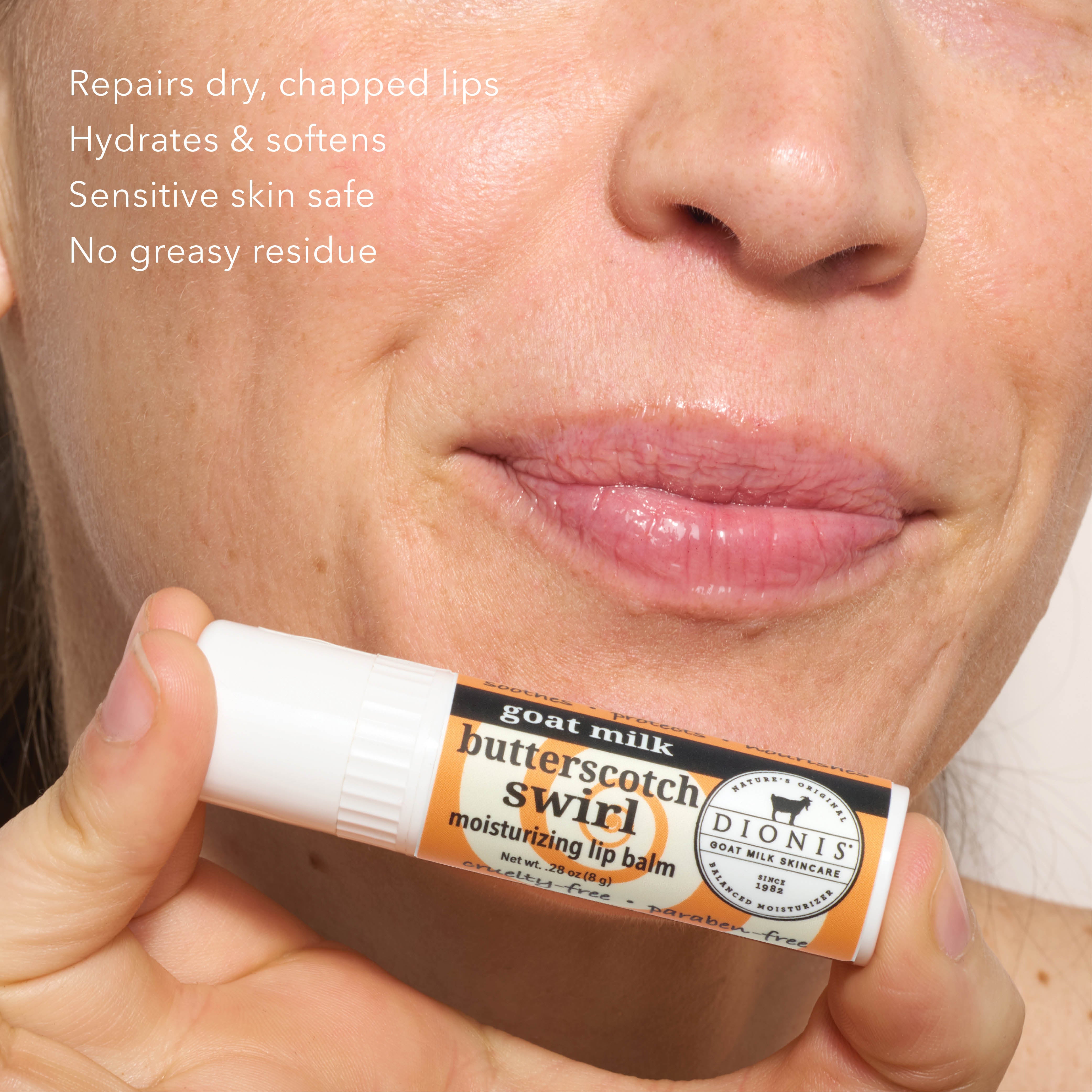 A close-up of a person's lower face holding a tube of Dionis Butterscotch Swirl moisturising lip balm. The image includes white text on the top left detailing the balm's benefits.