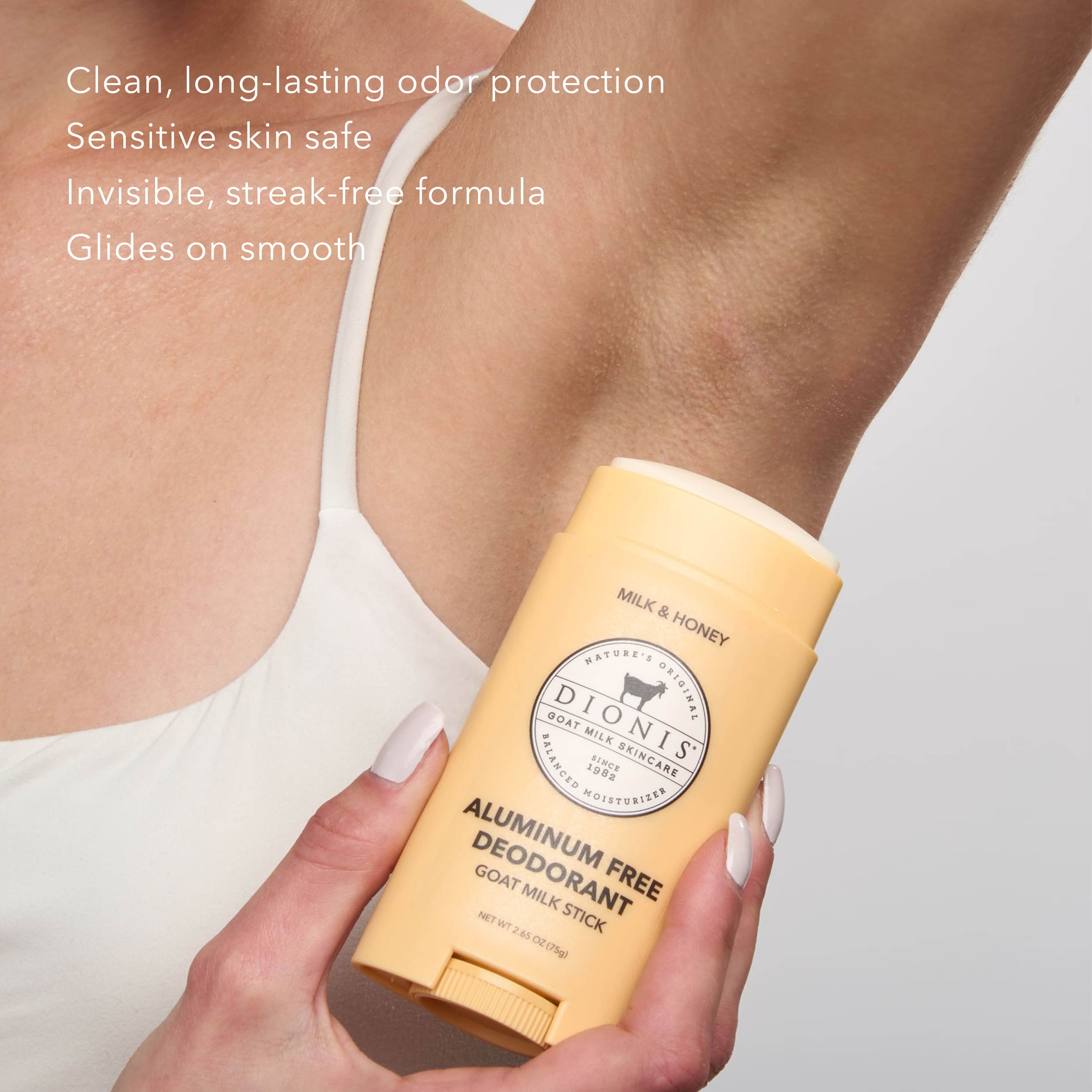 A woman applying Dionis Goat Milk Deodorant to her underarm. Text on the image reads "Clean, long-lasting odor protection. Sensitive Skin Safe. Invisible, streak-free formula. Glides on smooth."