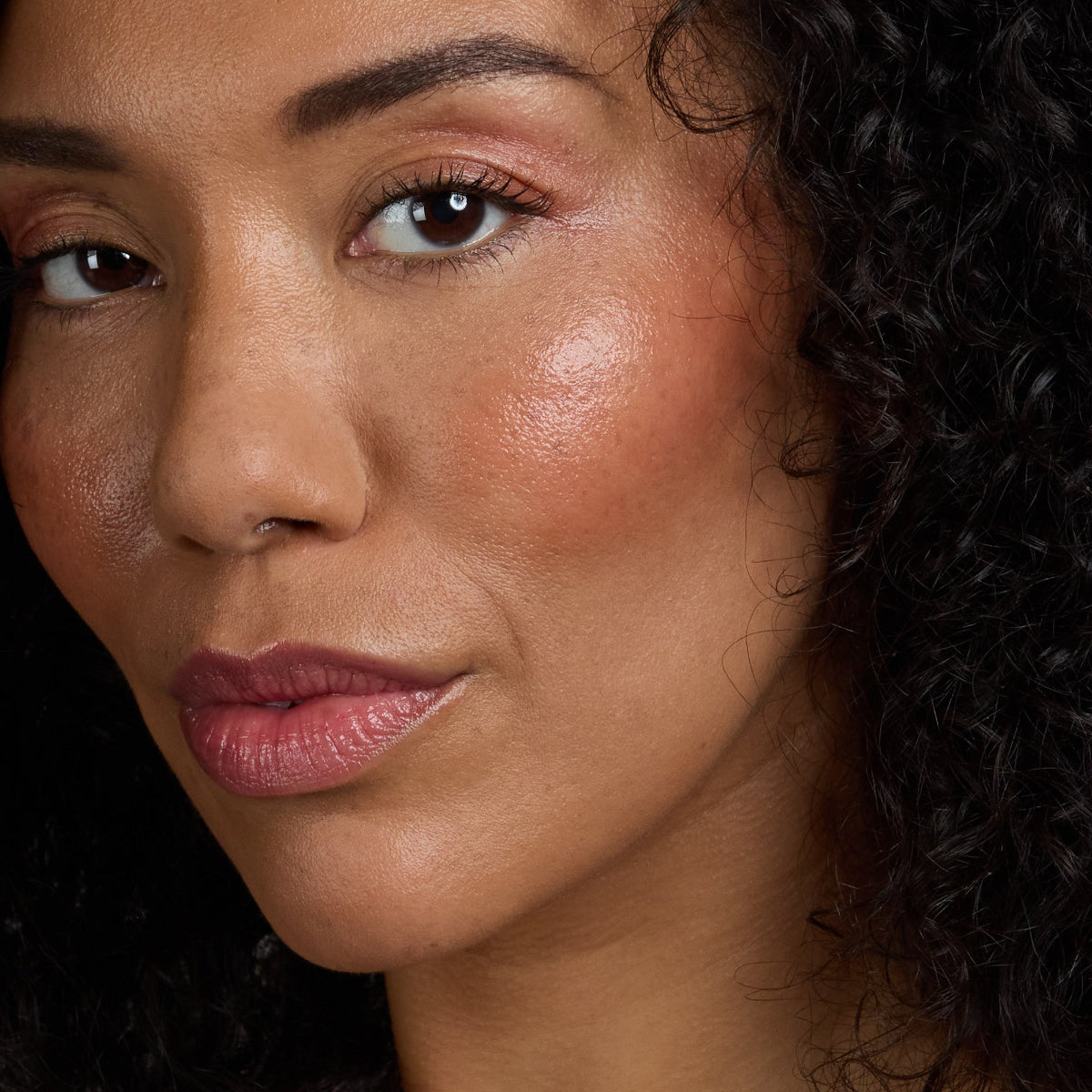 woman's face after applying tinted beauty balm in Petal color