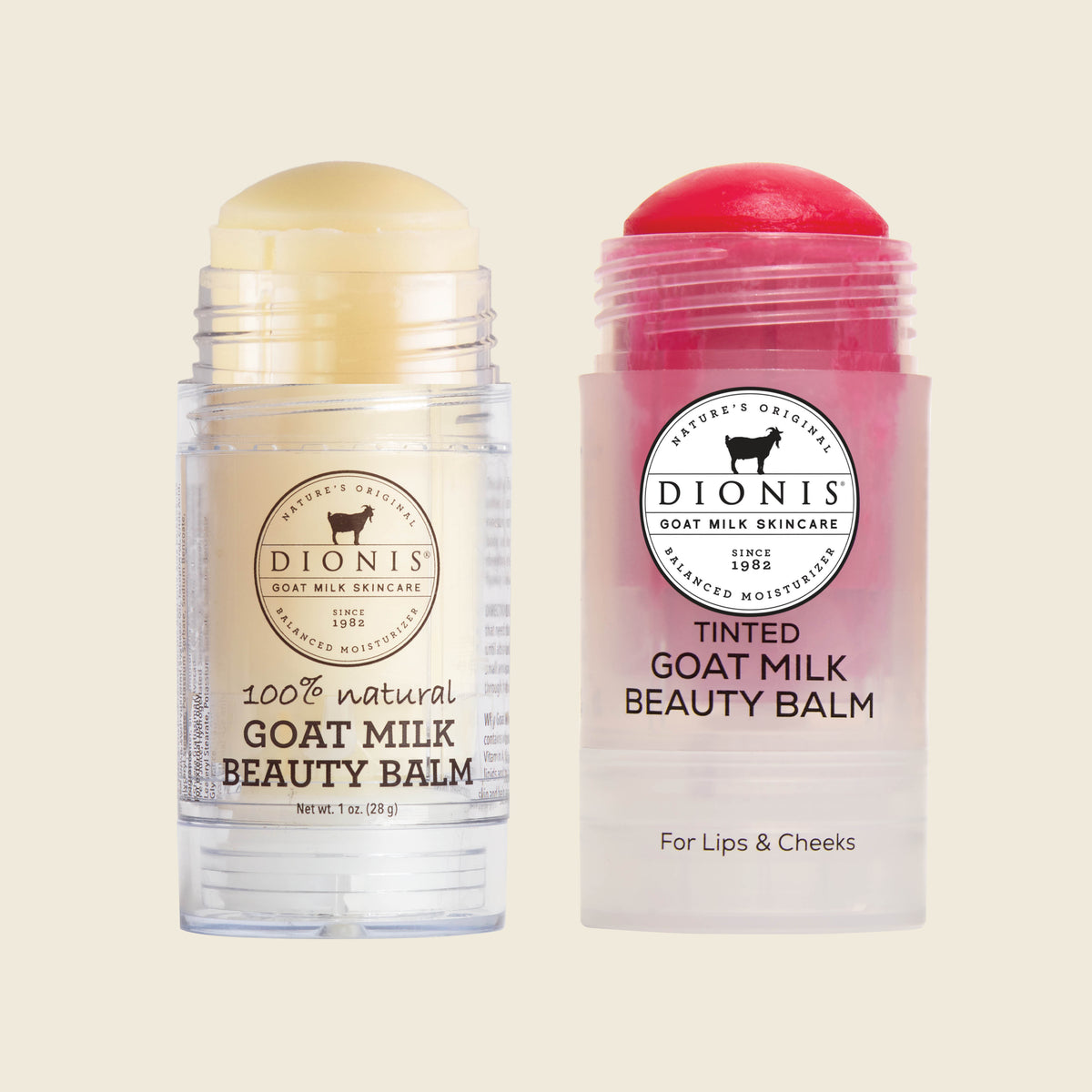 Two tubes of Dionis Goat Milk Beauty Balm on a light beige background. The left tube is clear with a pale yellow balm stick inside.