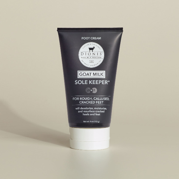 Tube of Dionis Goat Milk Sole Keeper foot cream on a beige background