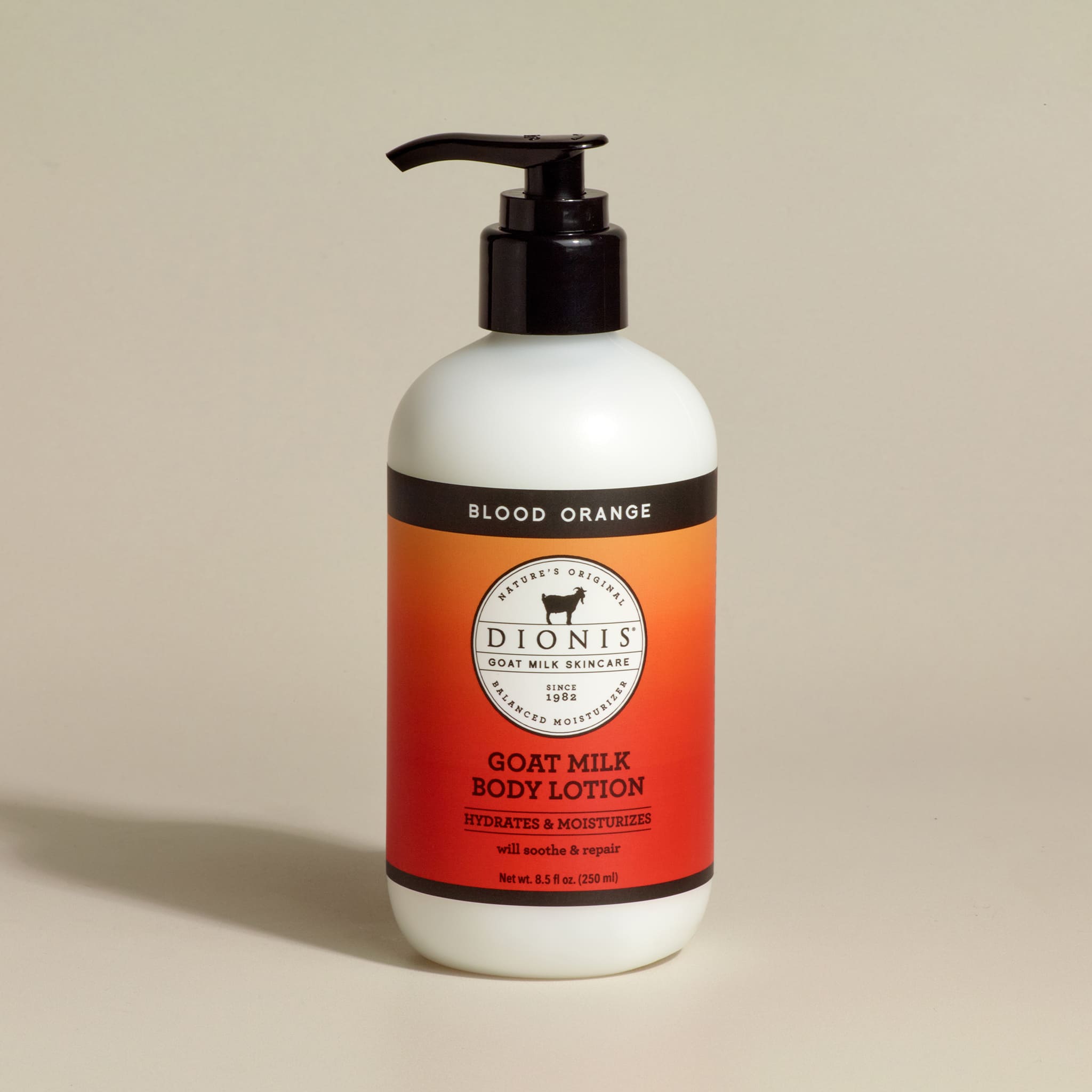 Dionis Goat Milk Body Lotion, Blood Orange, 8.5 fl oz with black pump.
