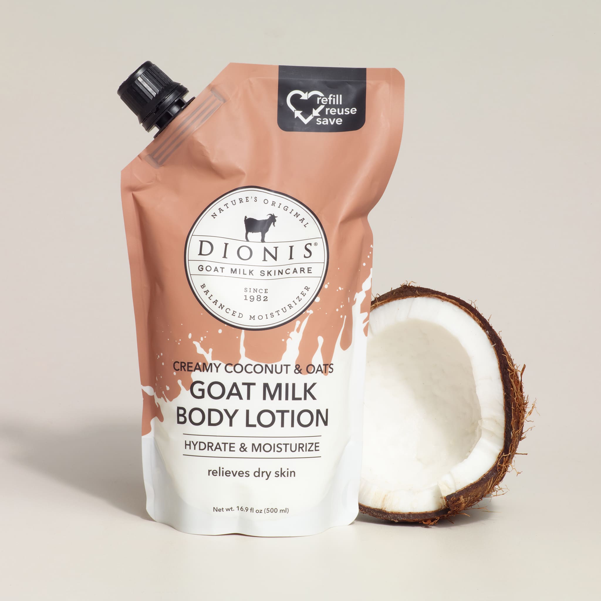 Dionis goat milk body lotion packaging with a coconut on a light background