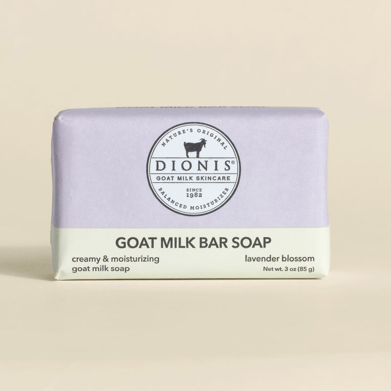 Bar of goat milk soap with 'Dionis' branding on a beige background