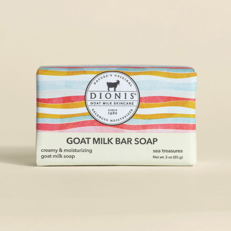 Dionis goat milk bar soap with colorful packaging on a beige background