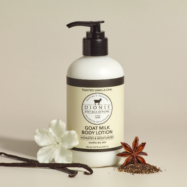 Dionis Goat Milk Body Lotion, Toasted Vanilla & Chai, 8.5 fl oz with black pump and vanilla flowers. 