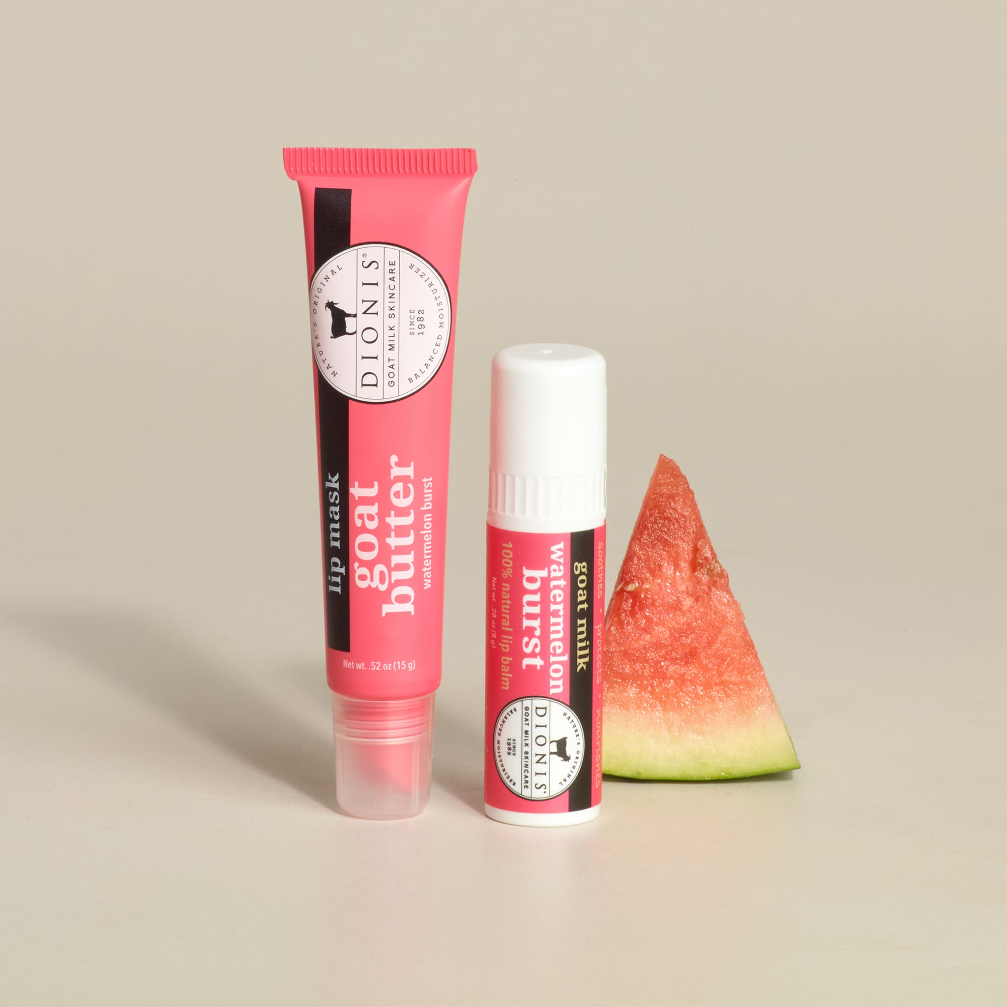 Dionis Goat Milk Skincare Watermelon Lip Balm & Watermelon Lip Mask with a watermelon wedge on a beige background