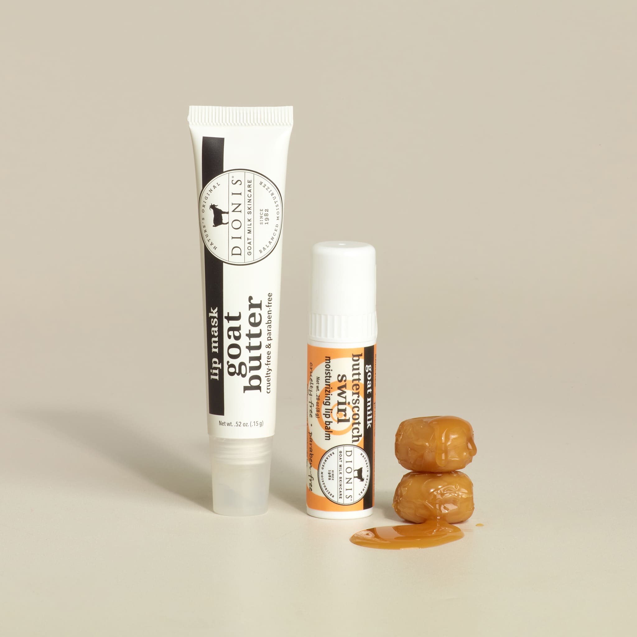 Two lip balm tubes with a small container of lip balm on a beige background