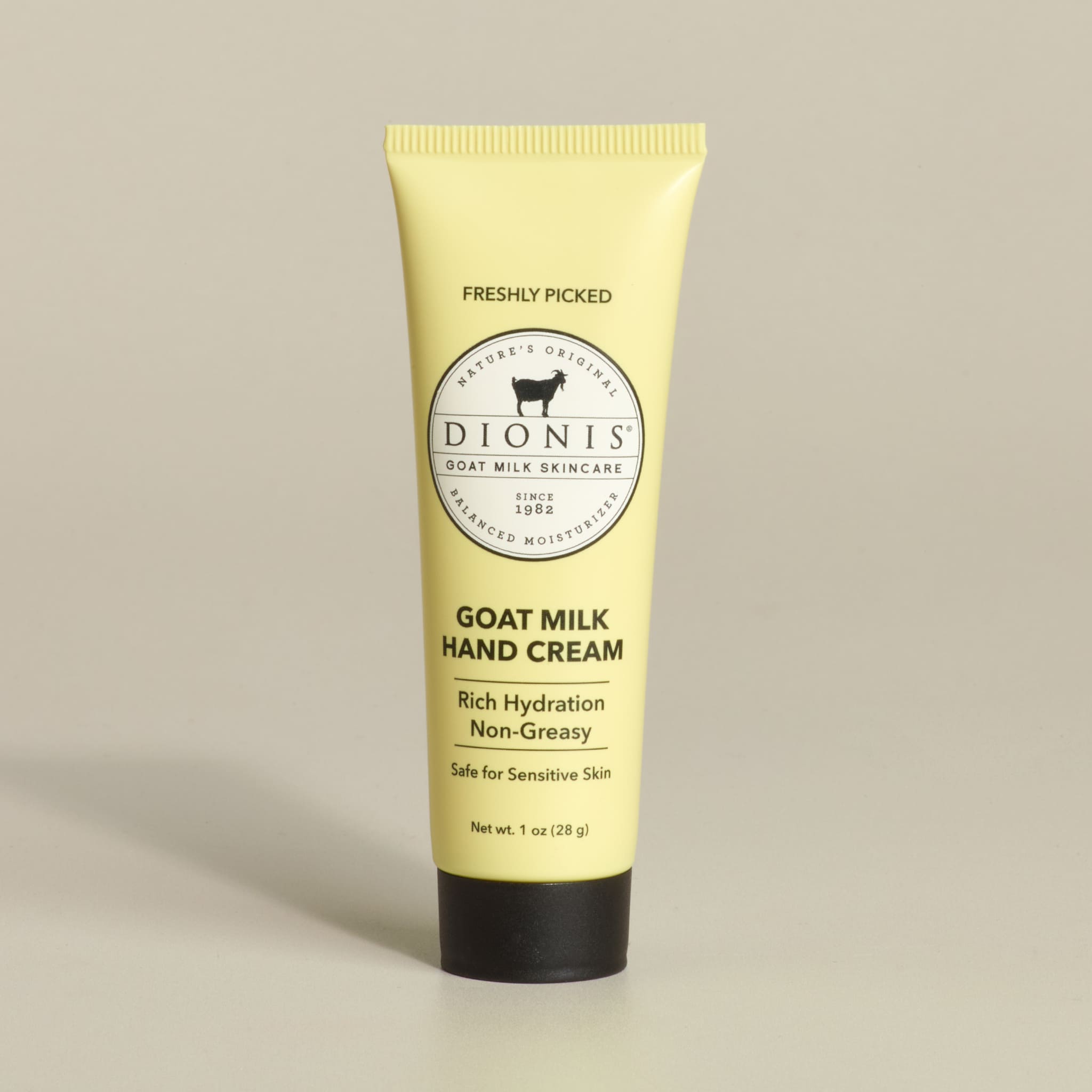Tube of Dionis Goat Milk Hand Cream, Freshly Picked Fragrance, on a beige background