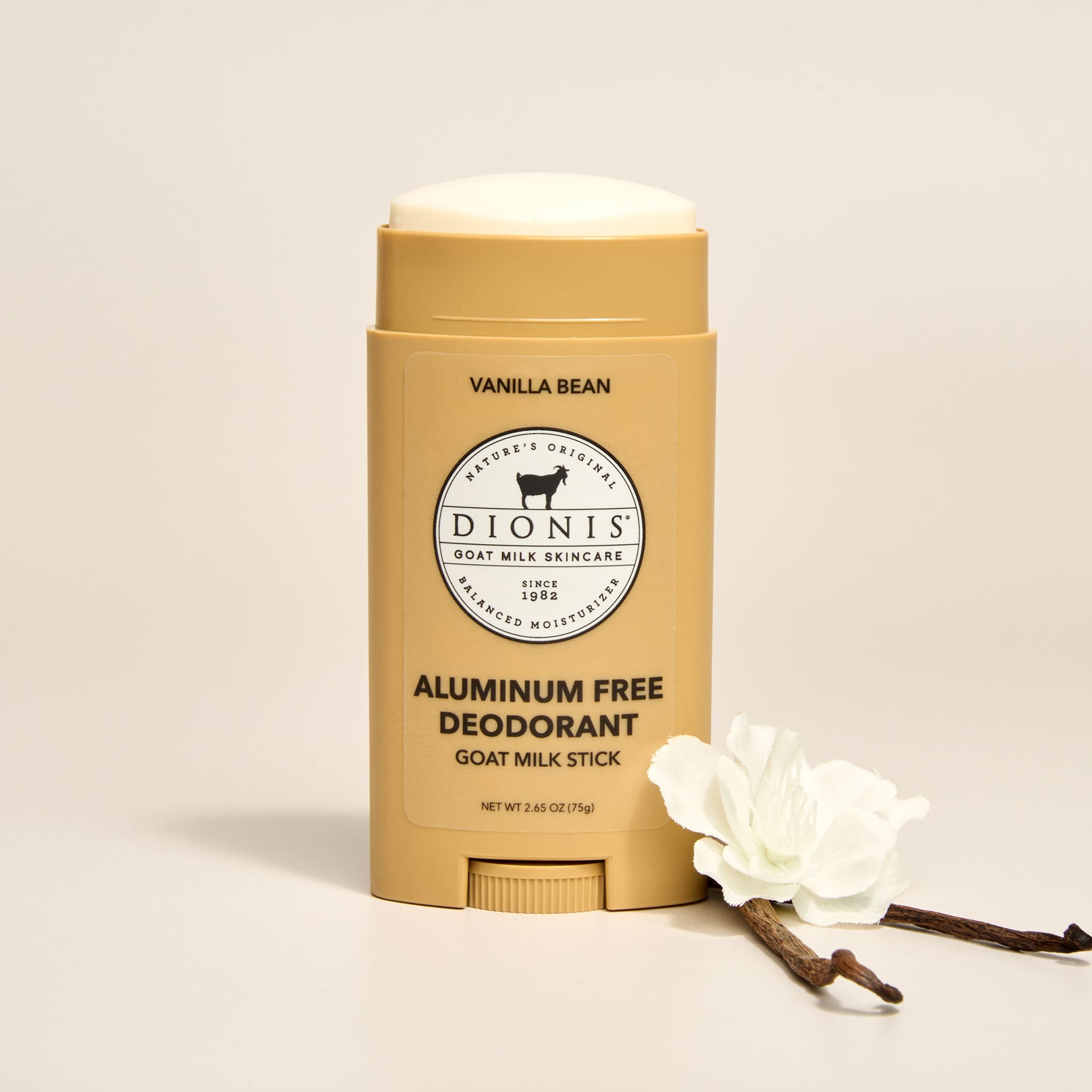 Dionis vanilla bean aluminum-free deodorant stick with a white flower on a beige background