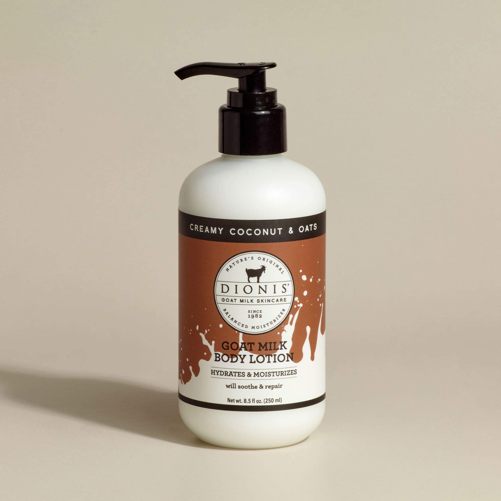 Dionis Goat Milk Body Lotion, Creamy Coconut & Oats, 8.5 fl oz with black pump.