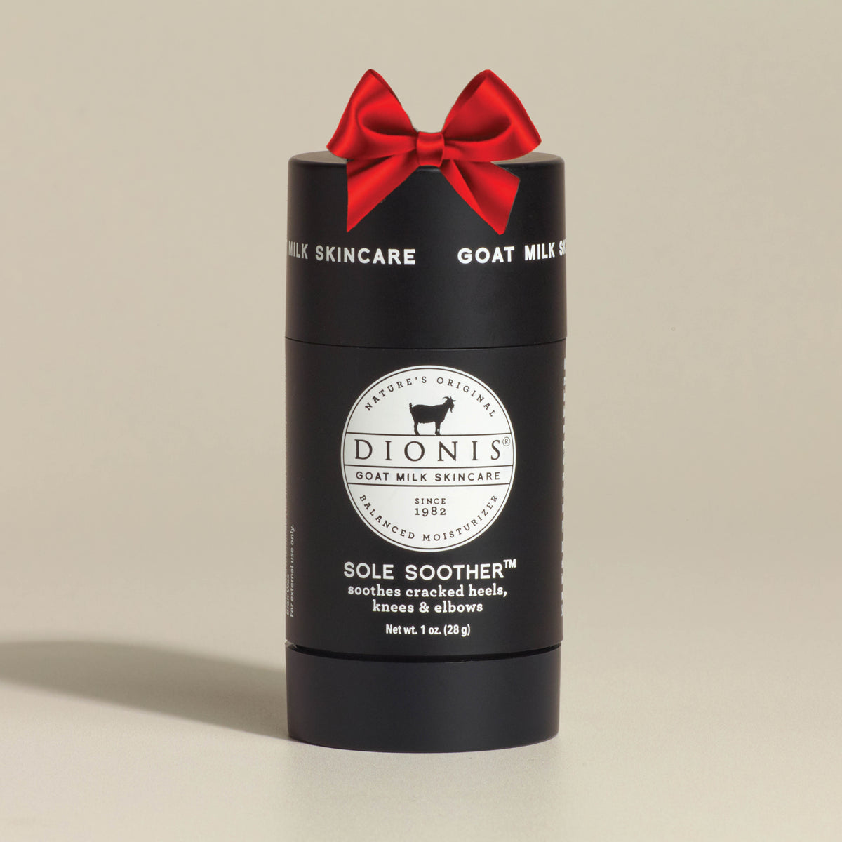 Black container of Dionis Goat Milk Skincare Sole Soother on a beige background