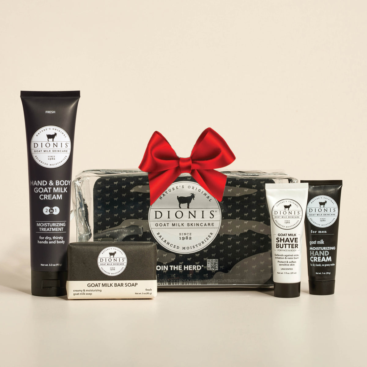 Dionis goat milk skincare products including shave cream, bar soap, and hand cream, body cream and a travel case on a beige background