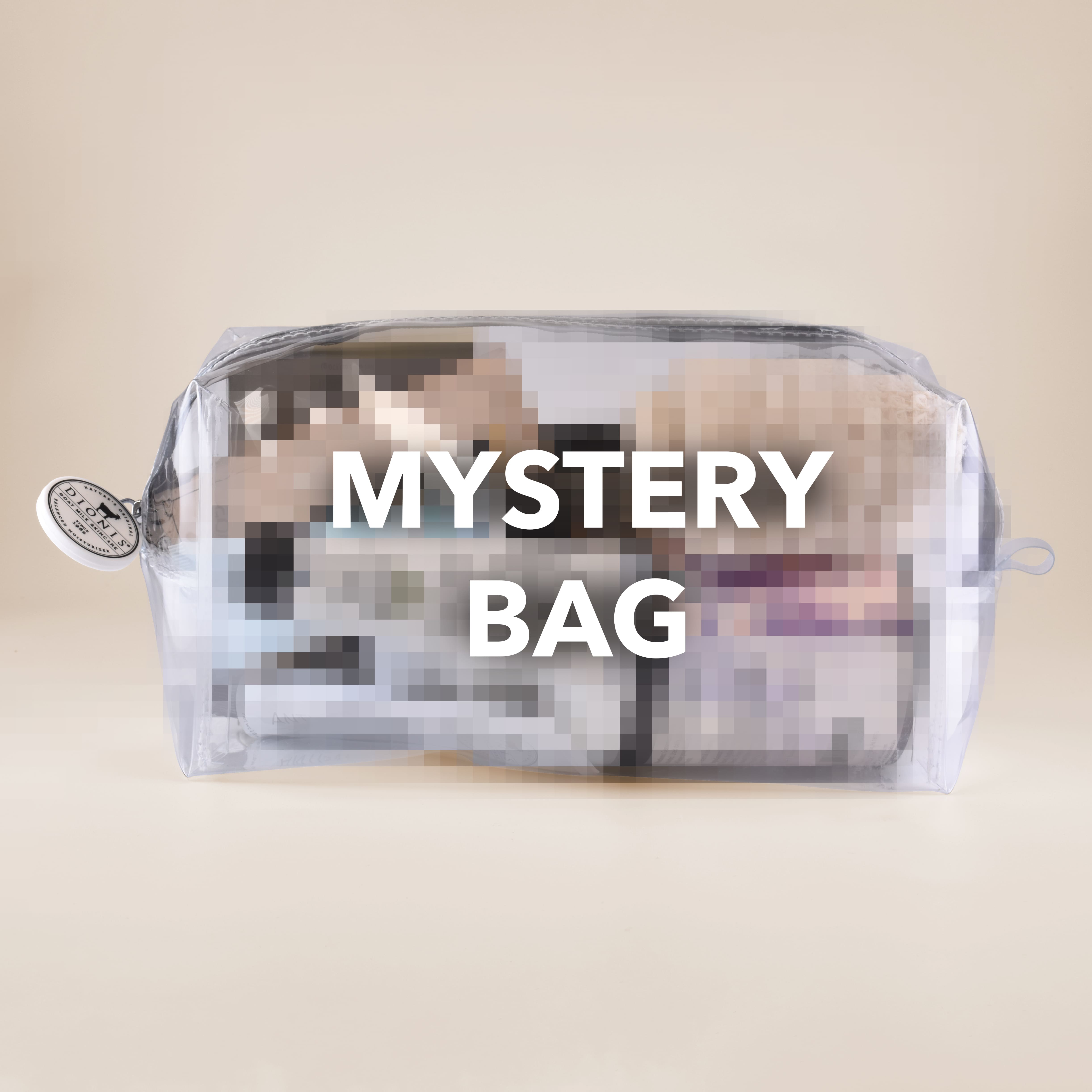 Mystery Bag - a clear reusable travel toiletry bag filled with items that are blurred out to maintain the mystery, with the words Mystery Bag across the front, all on a beige background.