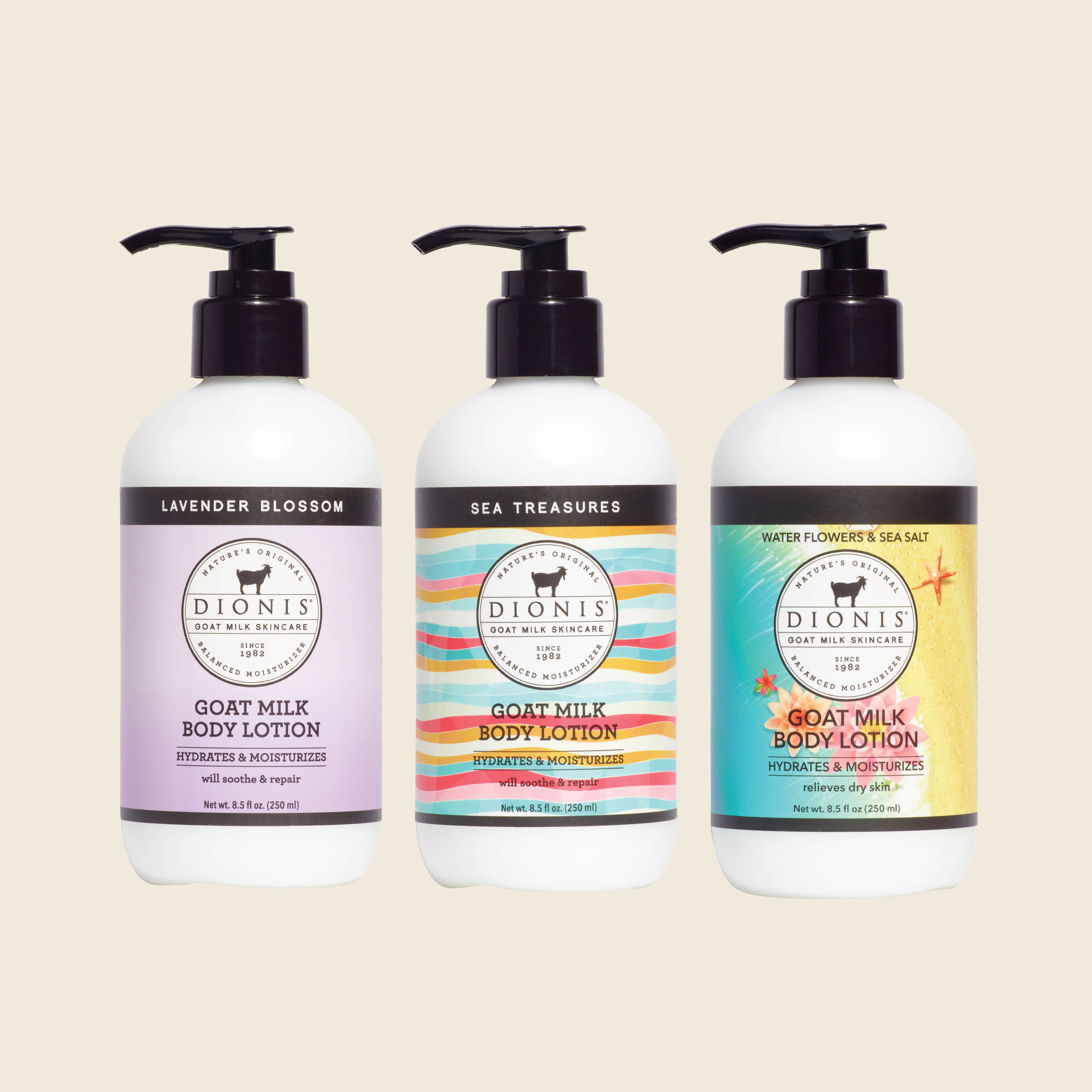 Three pump bottles of Dionis Goat Milk Body Lotion in Lavender Blossom, Sea Treasures, and Water Flowers & Sea Salt scents, arranged side-by-side on a light beige background.