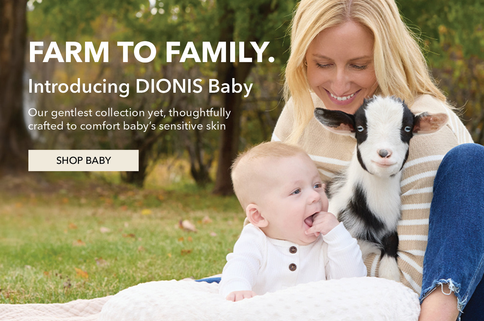 A promotional outdoor photo shows a smiling woman sitting on grass with a baby and a black-and-white goat. Large text reads 'FARM TO FAMILY. Introducing DIONIS Baby - Our gentles collection yet, thoughtfully crafted to comfort baby's sensitive skin.'