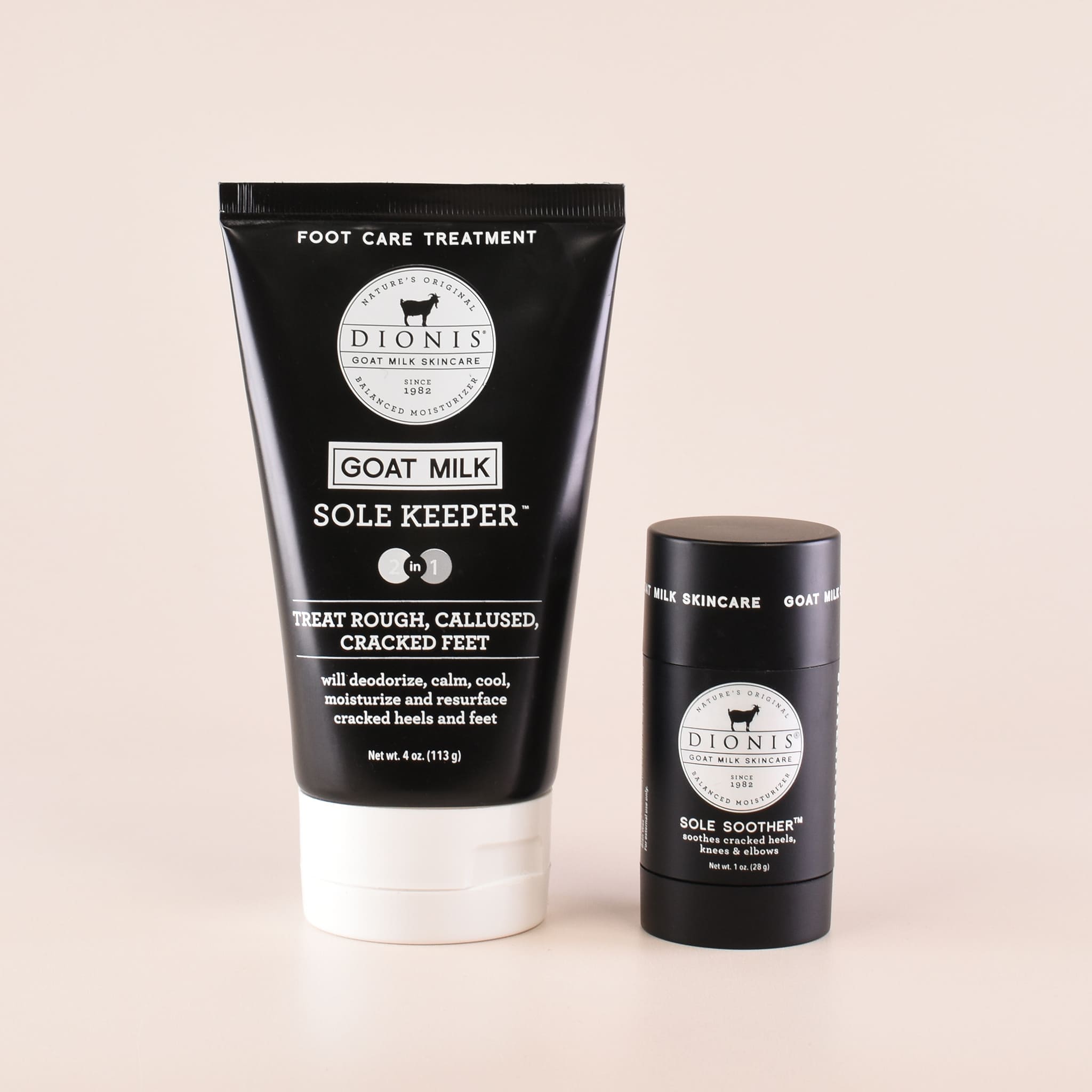 Dionis Sole Keeper foot care treatment in a black squeeze tube with a white cap, next to a matching black stick container labeled Sole Soother, on a light beige background.