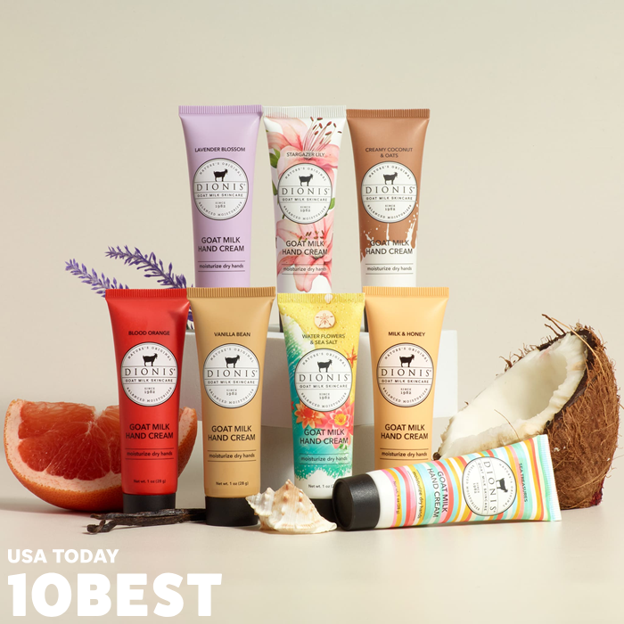 Dionis Goat Milk Skincare Expanded Hand Cream Set, featured on USA Today 10 Best, with their logo at the bottom left corner. The image shows 8 tubes of Dionis hand creams with various props like lavender, blood orange, sea shells, coconut and vanilla bean.