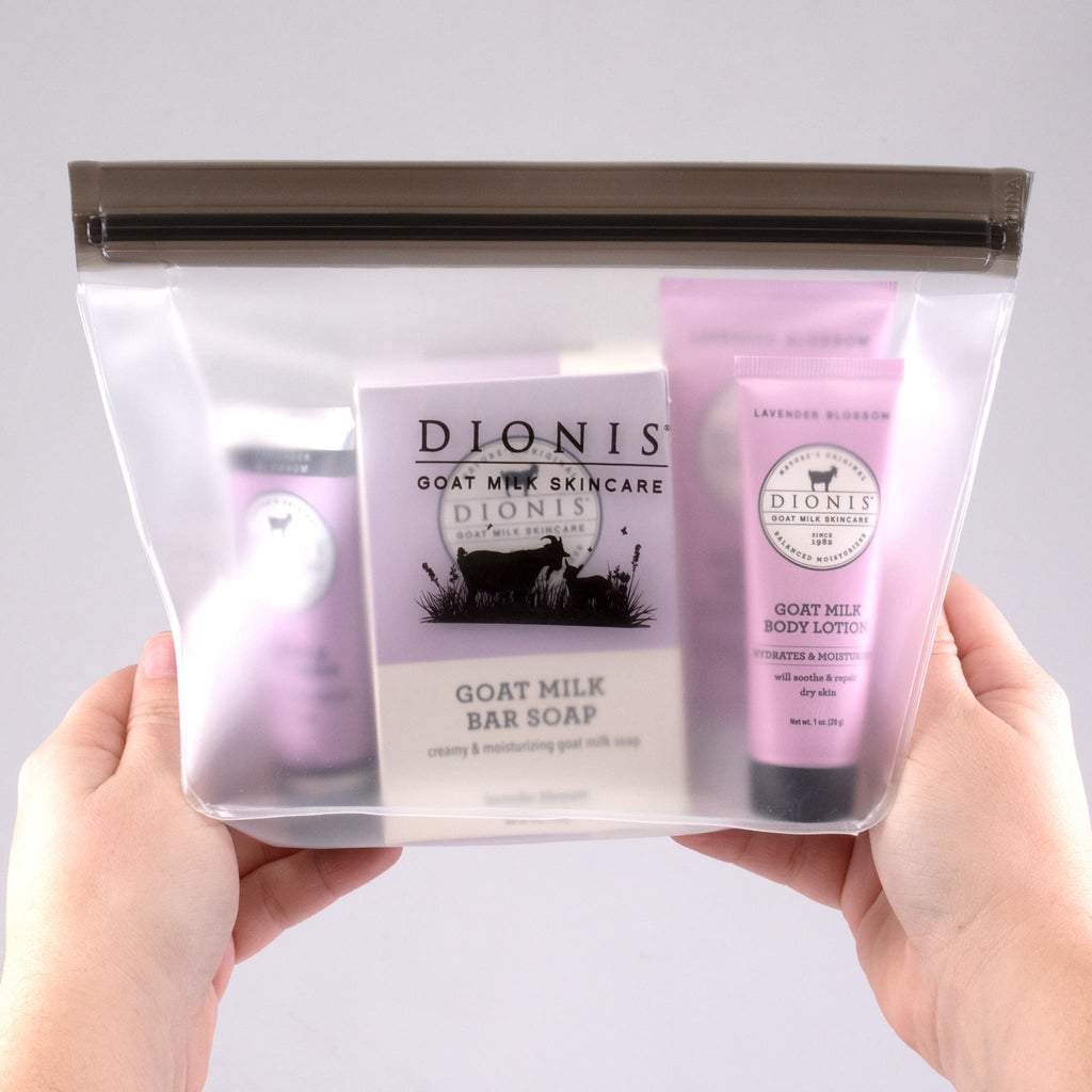 Hands holding Dionis Lavender Blossom Travel kit, with 5 products in a clear bag
